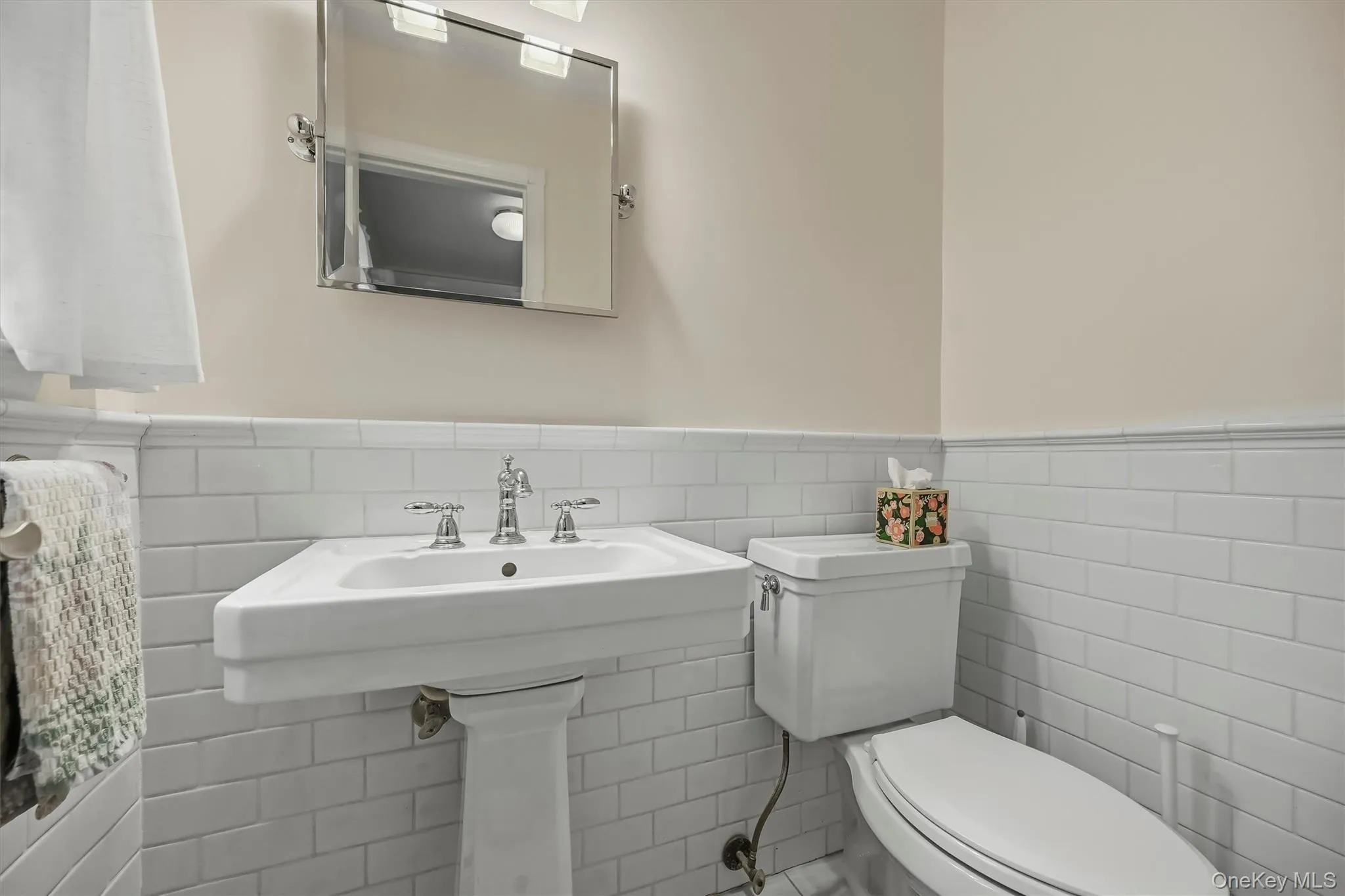 Updated clean and bright tiled powder room Updated clean and bright tiled powder room