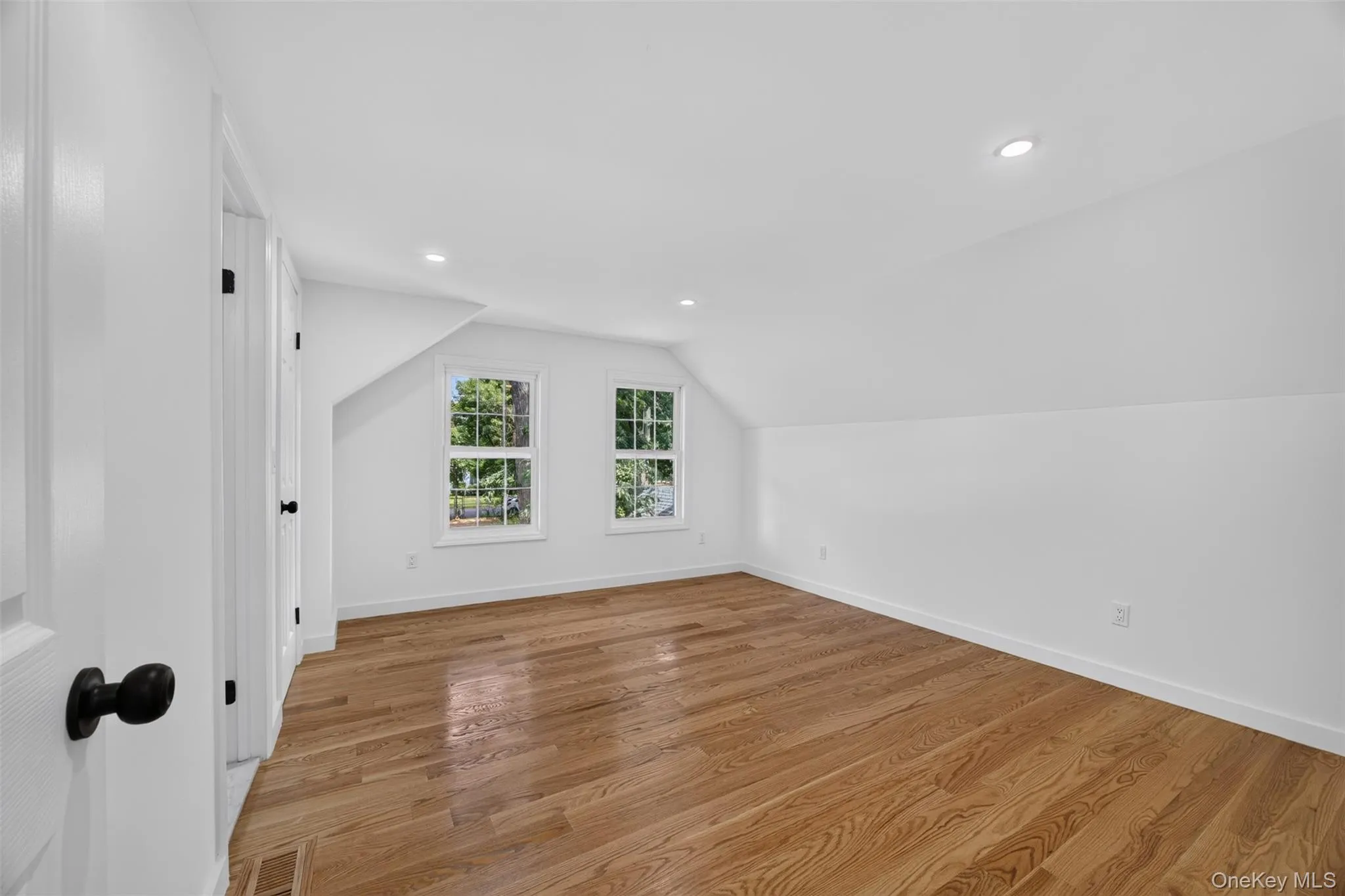 Wood-finish flooring with white trim Wood-finish flooring with white trim