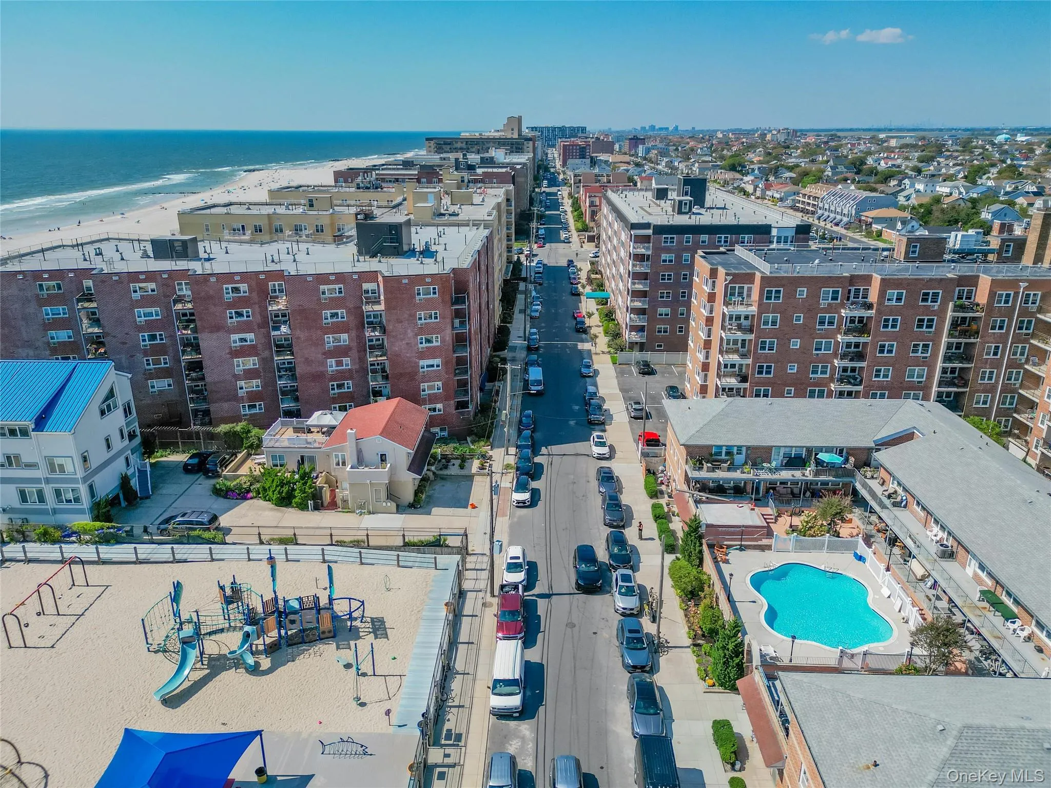 Aerial view of apartment complex / building and expansive coastline Aerial view of apartment complex / building and expansive coastline