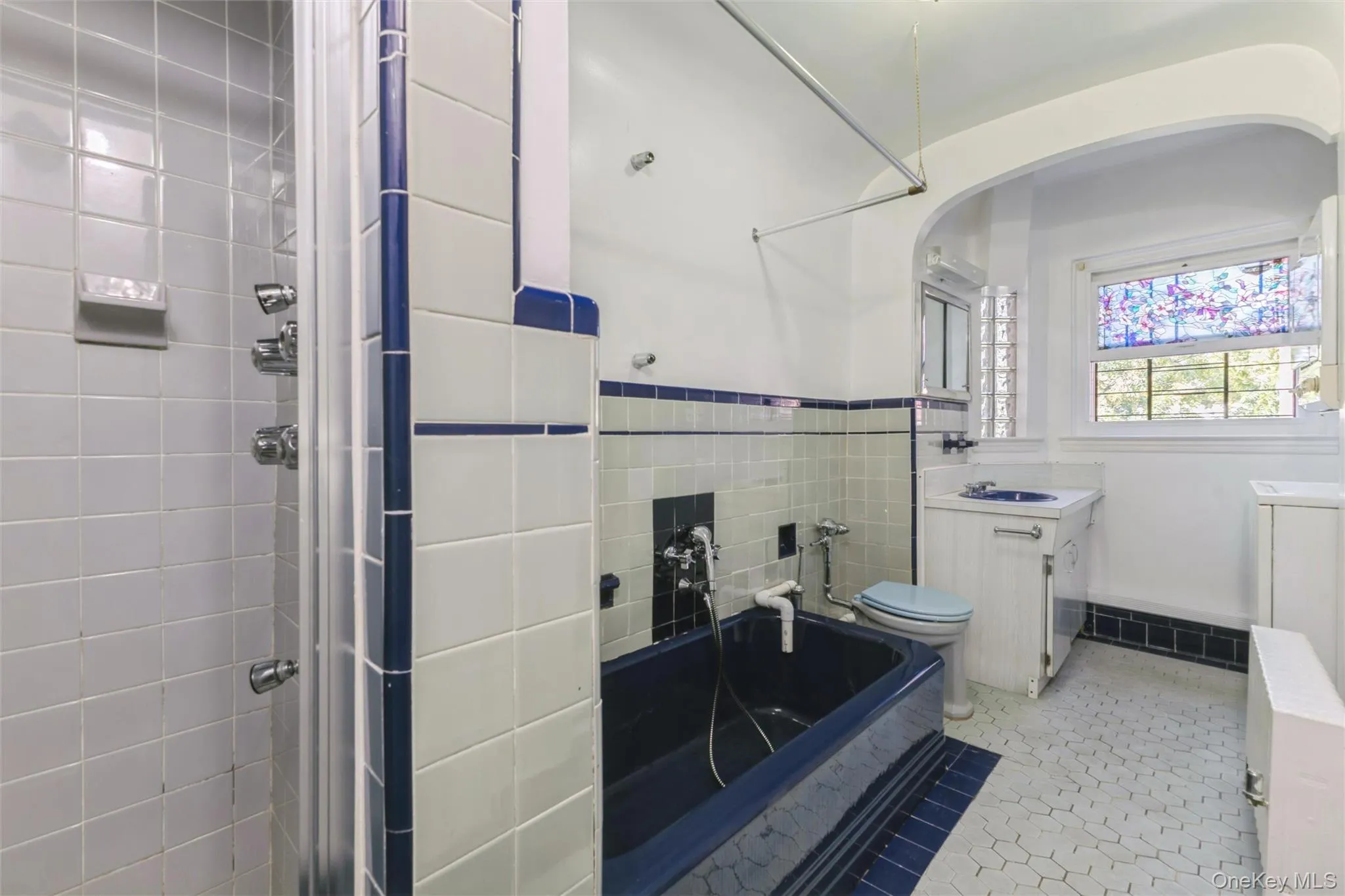 Oversized bathroom with separate tub and stall shower In unit washer/drer Oversized bathroom with separate tub and stall shower In unit washer/drer