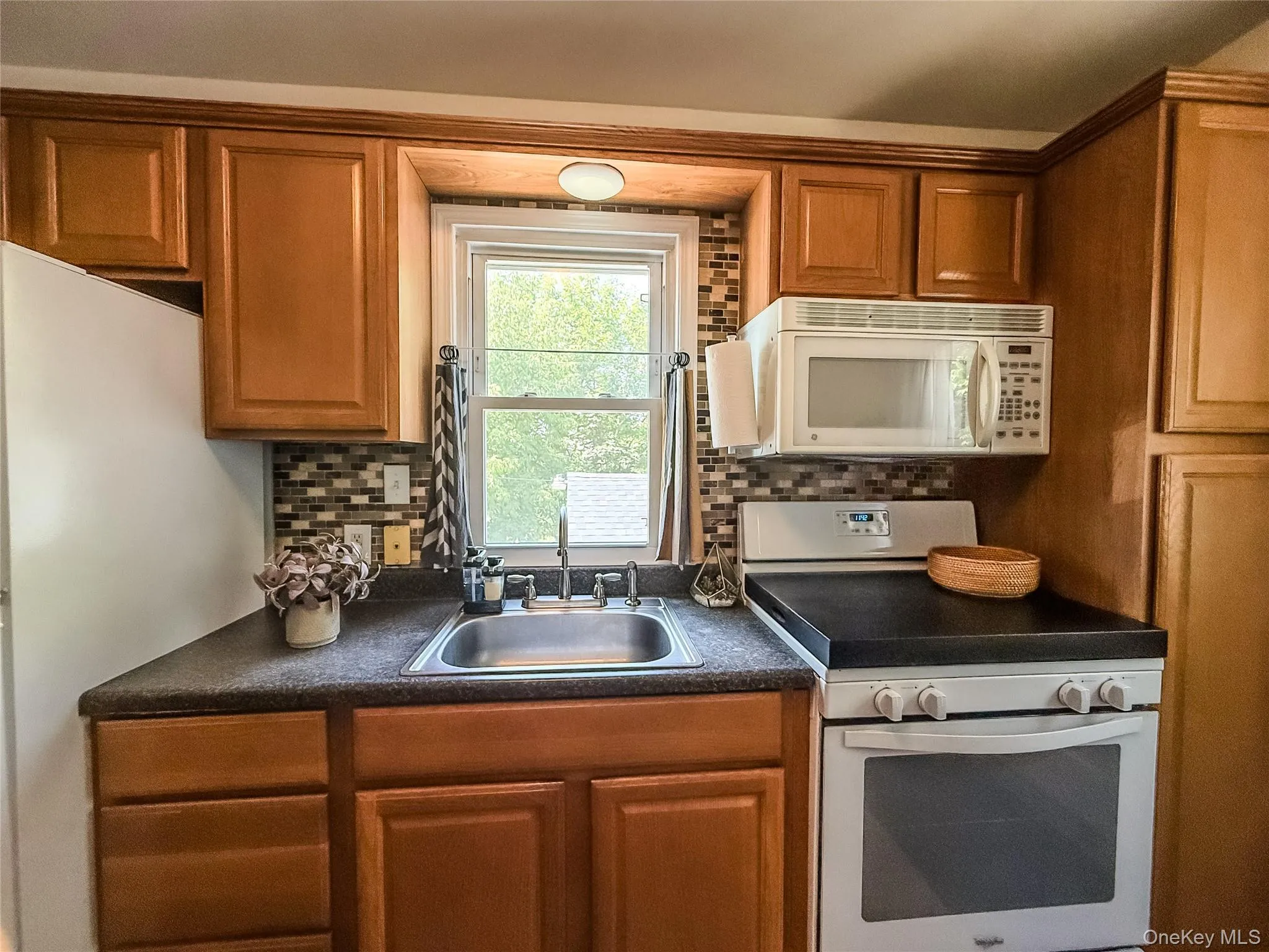 Upper Apartment Galley Kitchen with wood cabinets Upper Apartment Galley Kitchen with wood cabinets