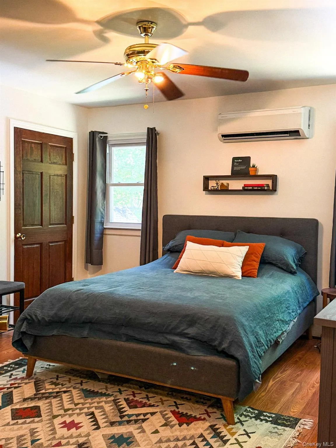 Upper Apartment Bedroom with Hardwood-style flooring and his and her closets Upper Apartment Bedroom with Hardwood-style flooring and his and her closets