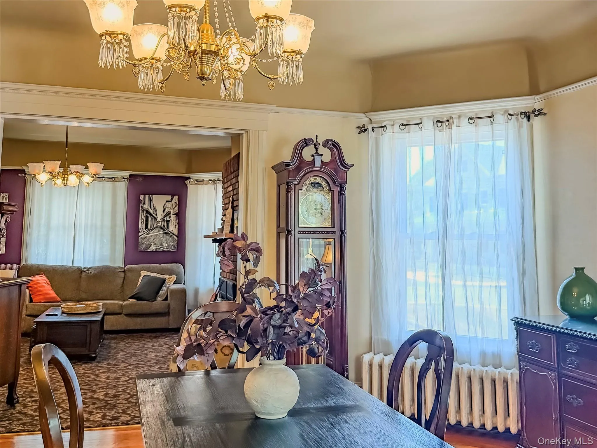 Main House Dining Room with Ornate chandelier with crystal accents Main House Dining Room with Ornate chandelier with crystal accents