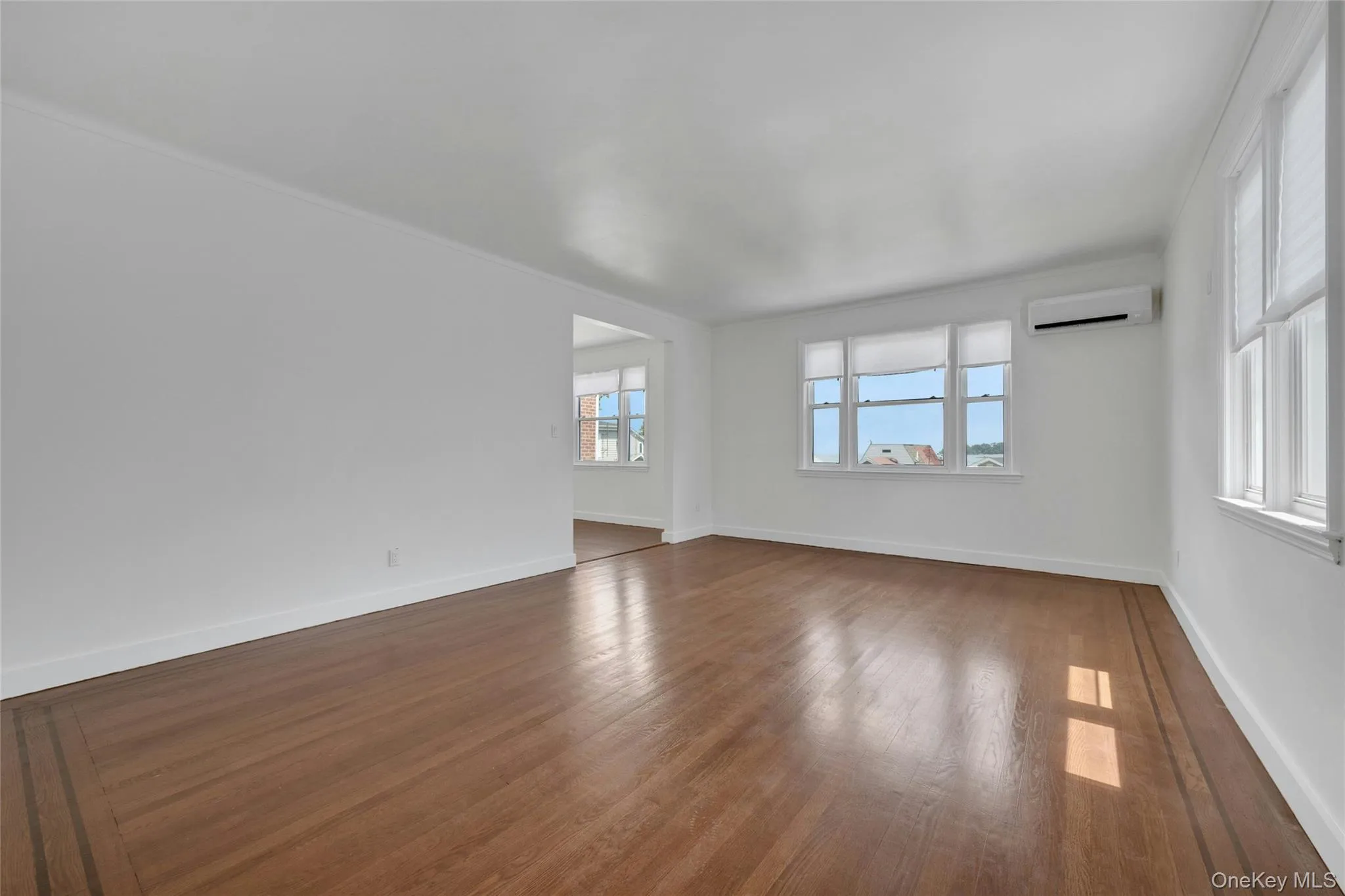 Living room with water views of the Long Island Sound and brand new split central a/c system Living room with water views of the Long Island Sound and brand new split central a/c system