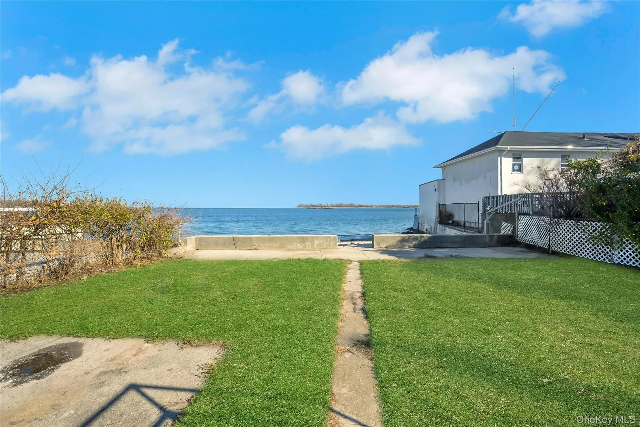 Backyard space leading to the beach and water Backyard space leading to the beach and water