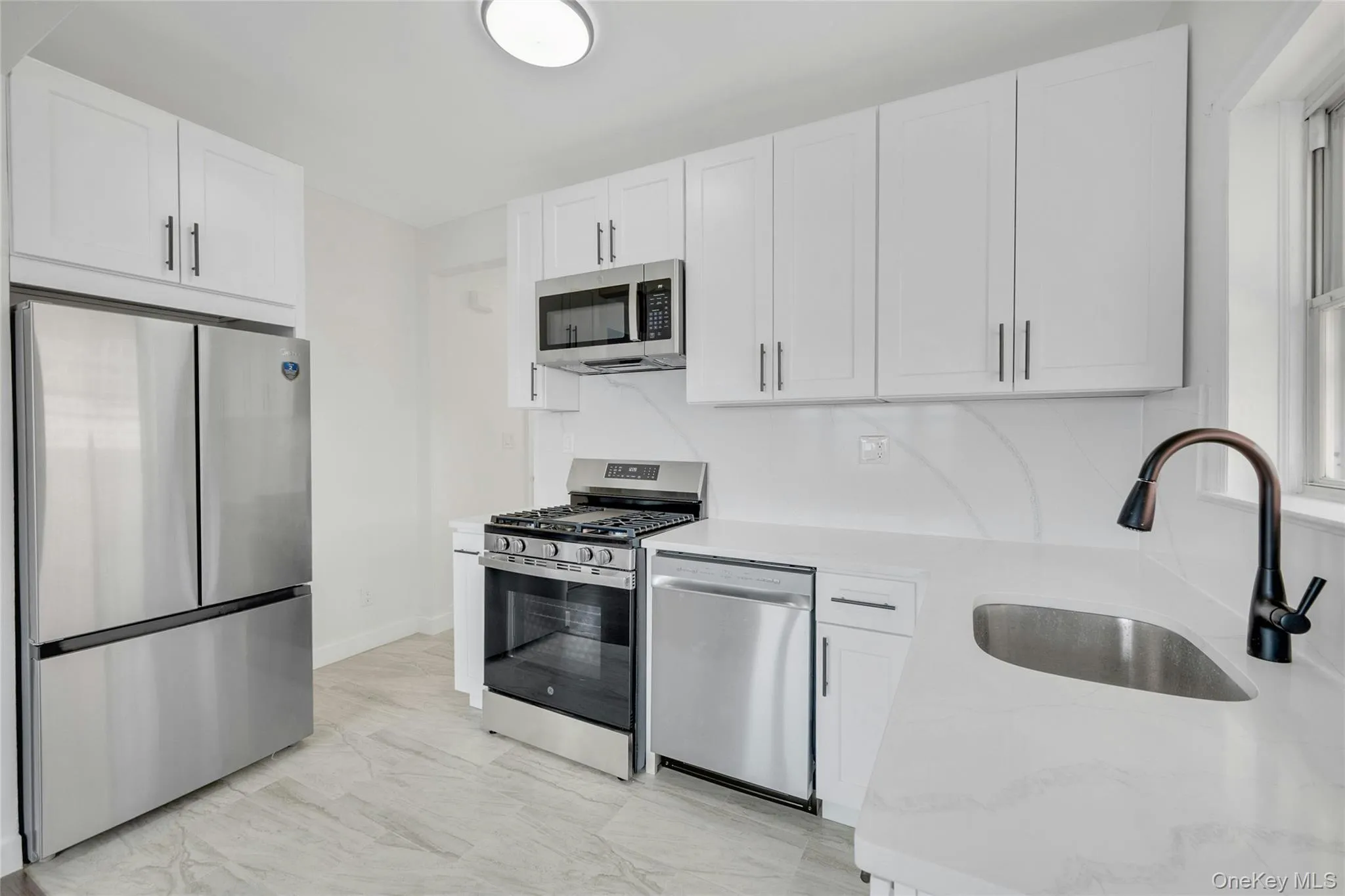 Brand new kitchen with all new stainless appliances, flooring and white cabinetry. Brand new kitchen with all new stainless appliances, flooring and white cabinetry.