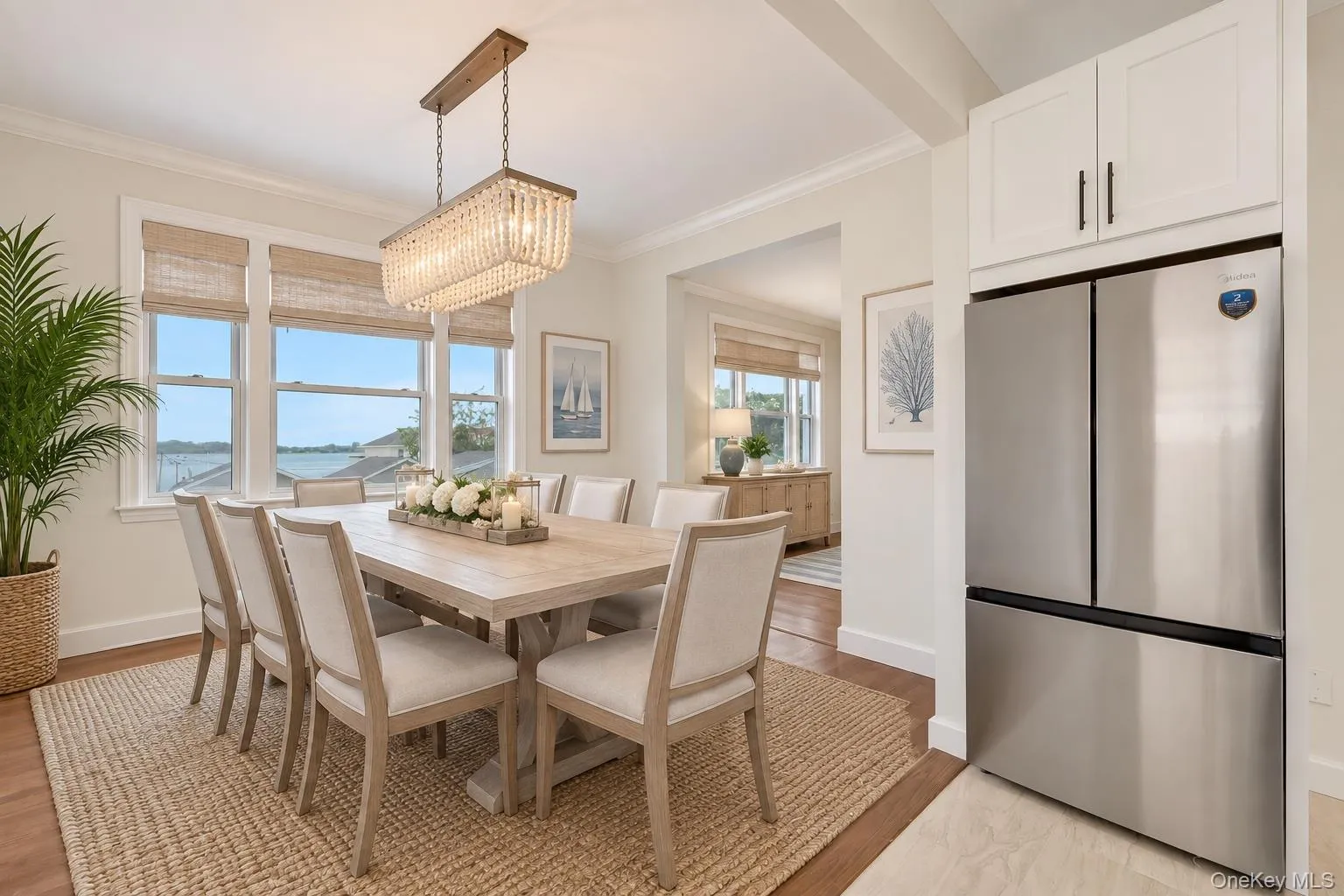 Virtual staged dining room with water views Virtual staged dining room with water views