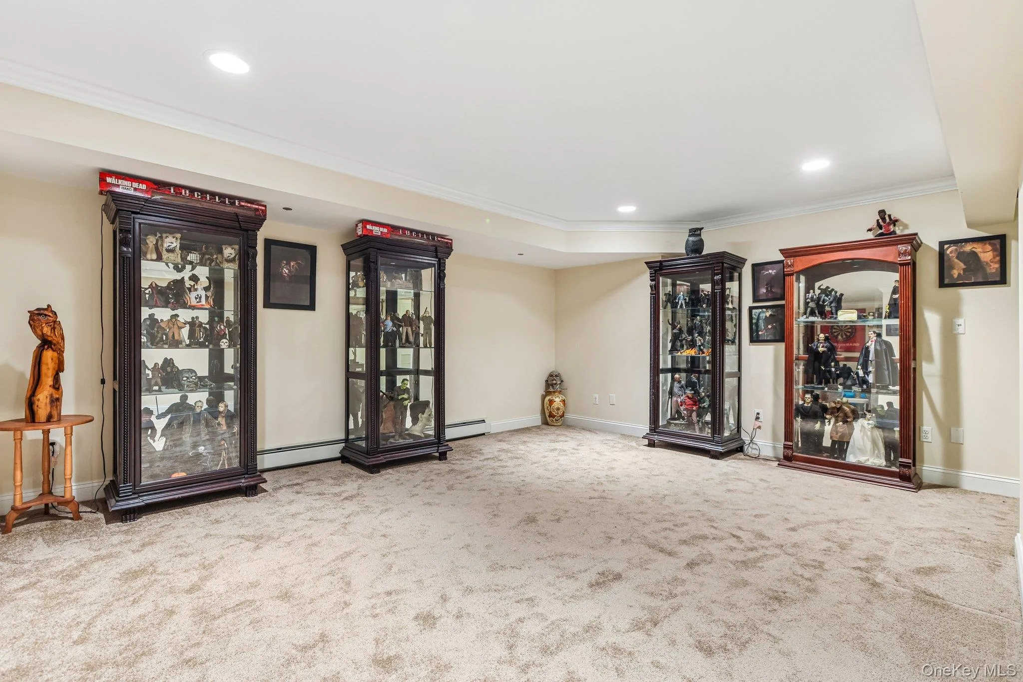 Recessed lighting, crown molding, and neutral wall tones complement the neutral carpeting Recessed lighting, crown molding, and neutral wall tones complement the neutral carpeting