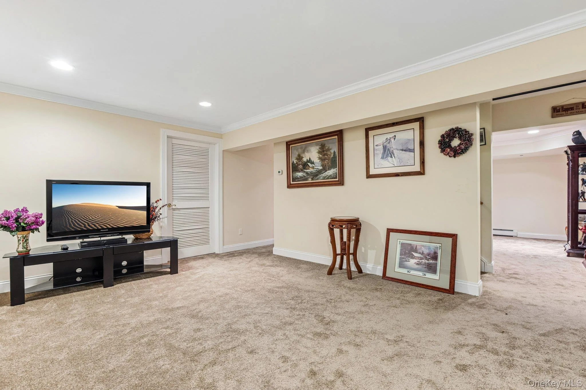 Recessed lighting, crown molding, light-colored wall paint, and neutral carpeting Recessed lighting, crown molding, light-colored wall paint, and neutral carpeting