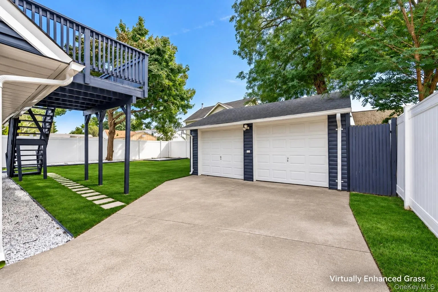 Virtually grown grass backyard facing 2 car detached garage Virtually grown grass backyard facing 2 car detached garage
