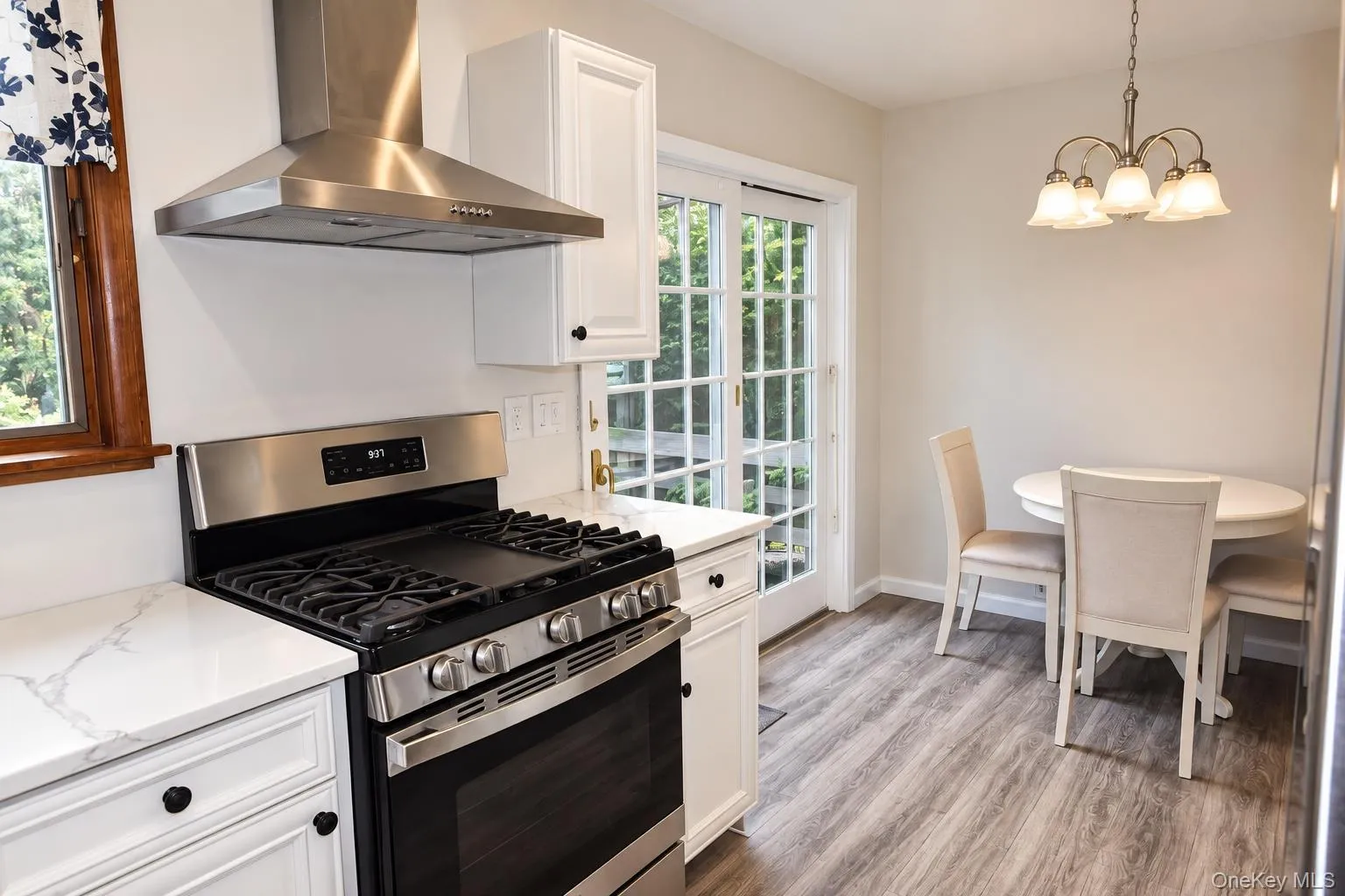 Eat-in kitchen with sliders to back deck. Eat-in kitchen with sliders to back deck.