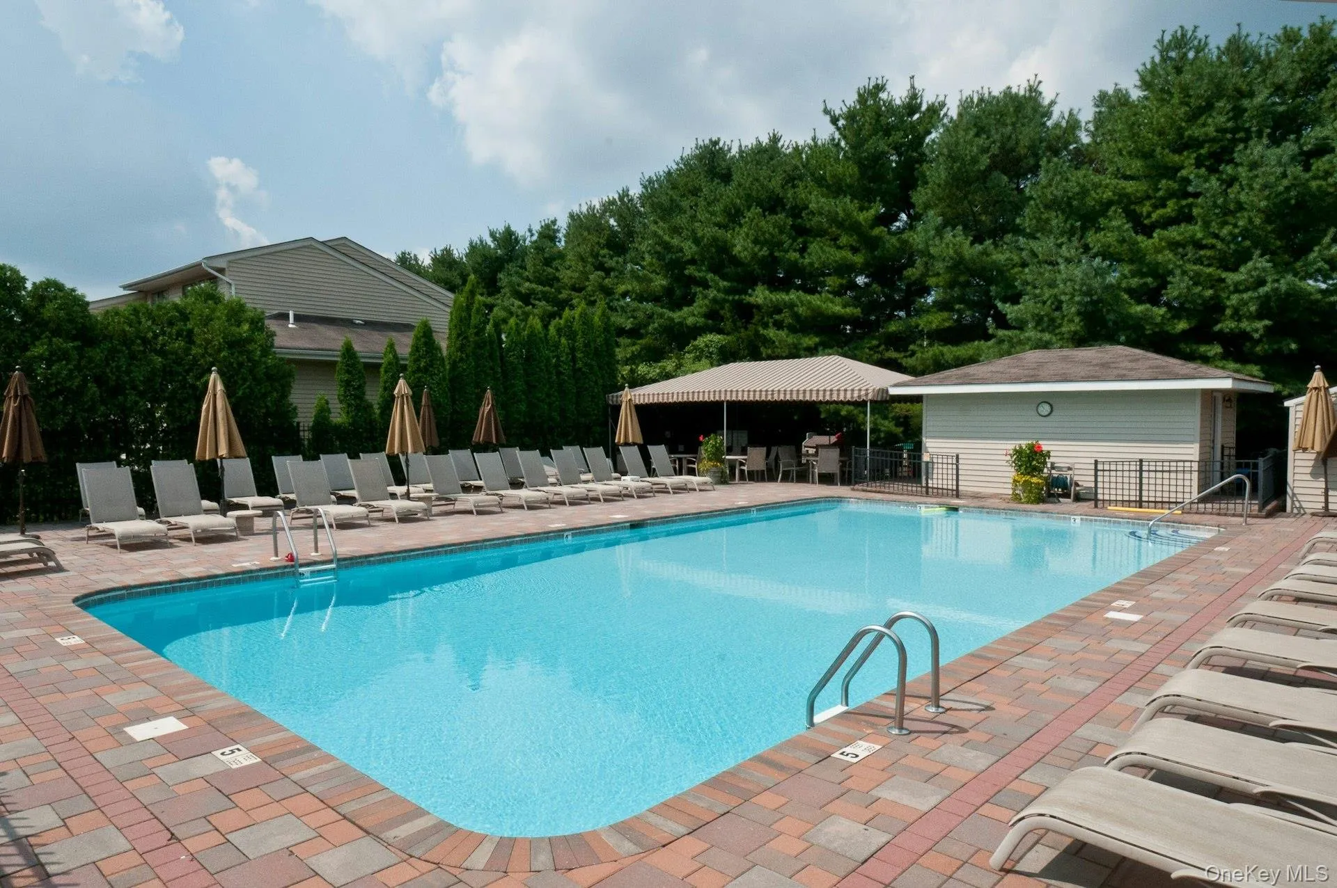 Community pool with lifeguard in season and bathrooms Community pool with lifeguard in season and bathrooms