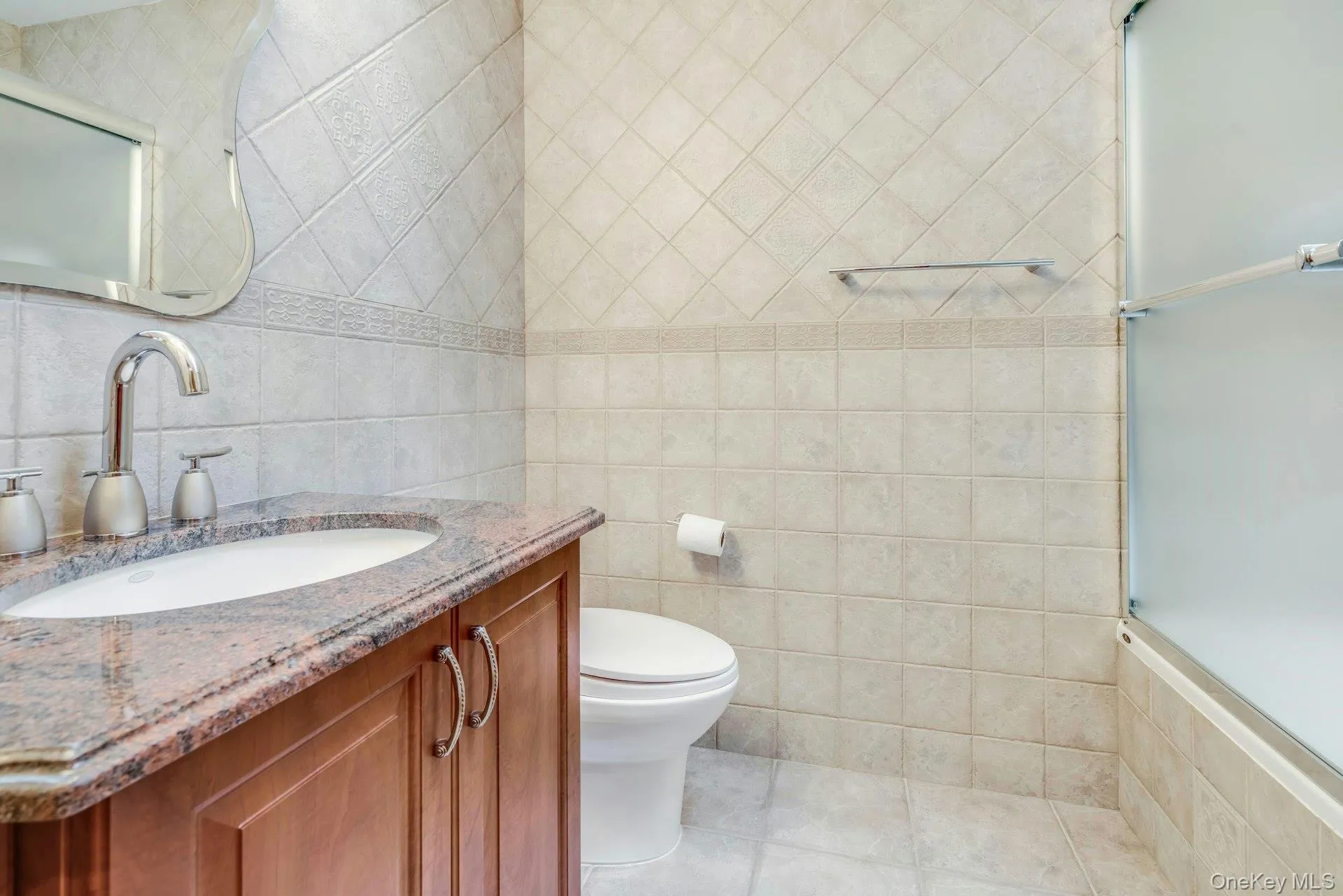 Bathroom with tub and frameless shower doors, granite vanity Bathroom with tub and frameless shower doors, granite vanity