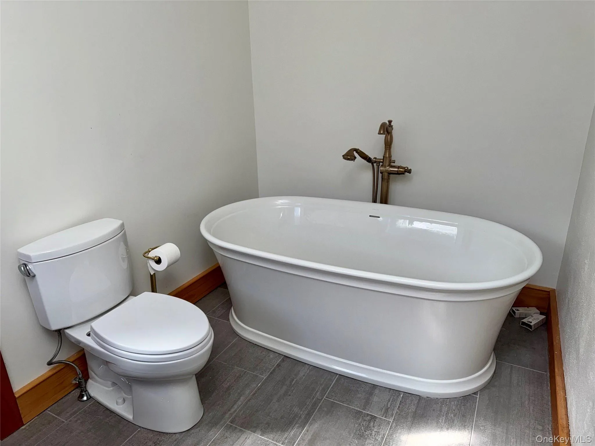 Primary Bathroom Soaking Tub and Slate Floors Primary Bathroom Soaking Tub and Slate Floors
