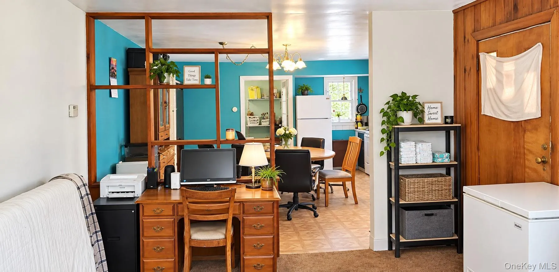 Wood-paneled wall, built-in room divider, and kitchen with a window Wood-paneled wall, built-in room divider, and kitchen with a window