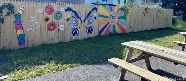 Wood privacy fence featuring vibrant murals Wood privacy fence featuring vibrant murals