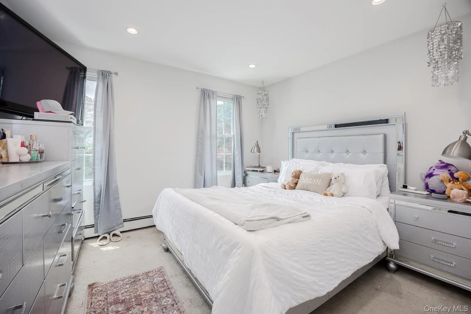 Bedroom 2 recessed lighting, two windows with natural light, and two decorative ceiling fixtures Bedroom 2 recessed lighting, two windows with natural light, and two decorative ceiling fixtures