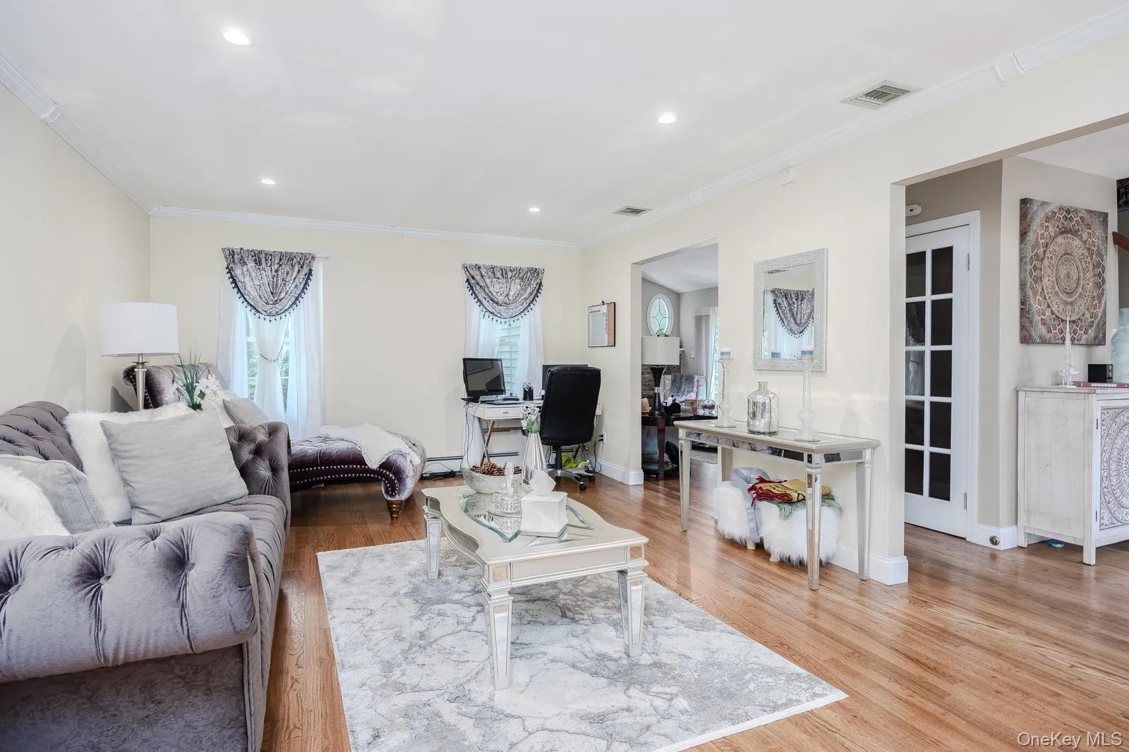 Hardwood-finish flooring, recessed lighting, crown molding, and decorative interior doors Hardwood-finish flooring, recessed lighting, crown molding, and decorative interior doors