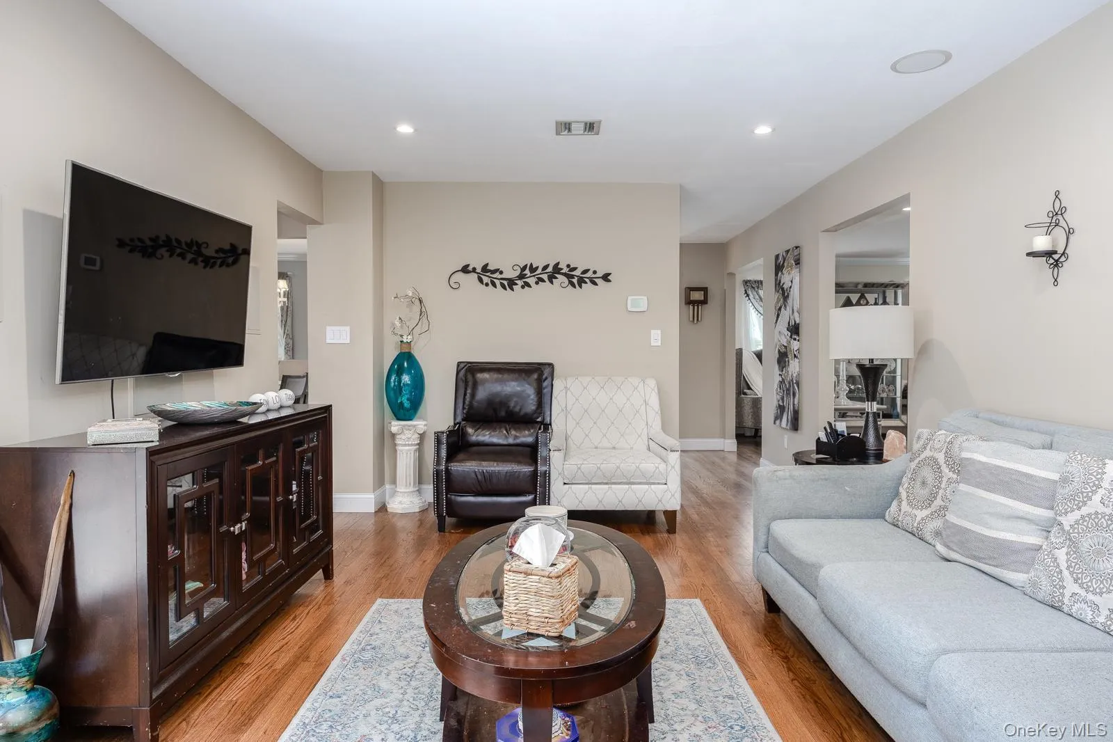Recessed lighting illuminates wood-finish flooring Recessed lighting illuminates wood-finish flooring