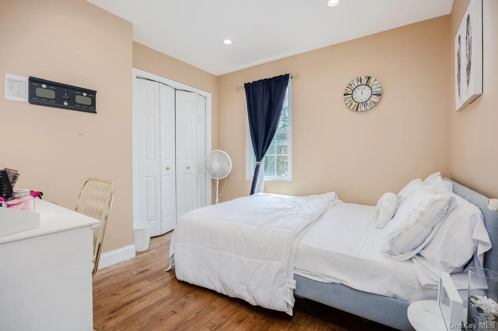 Bedroom 4 wood-finish flooring, recessed lighting, double bi-fold closet, and a single window Bedroom 4 wood-finish flooring, recessed lighting, double bi-fold closet, and a single window