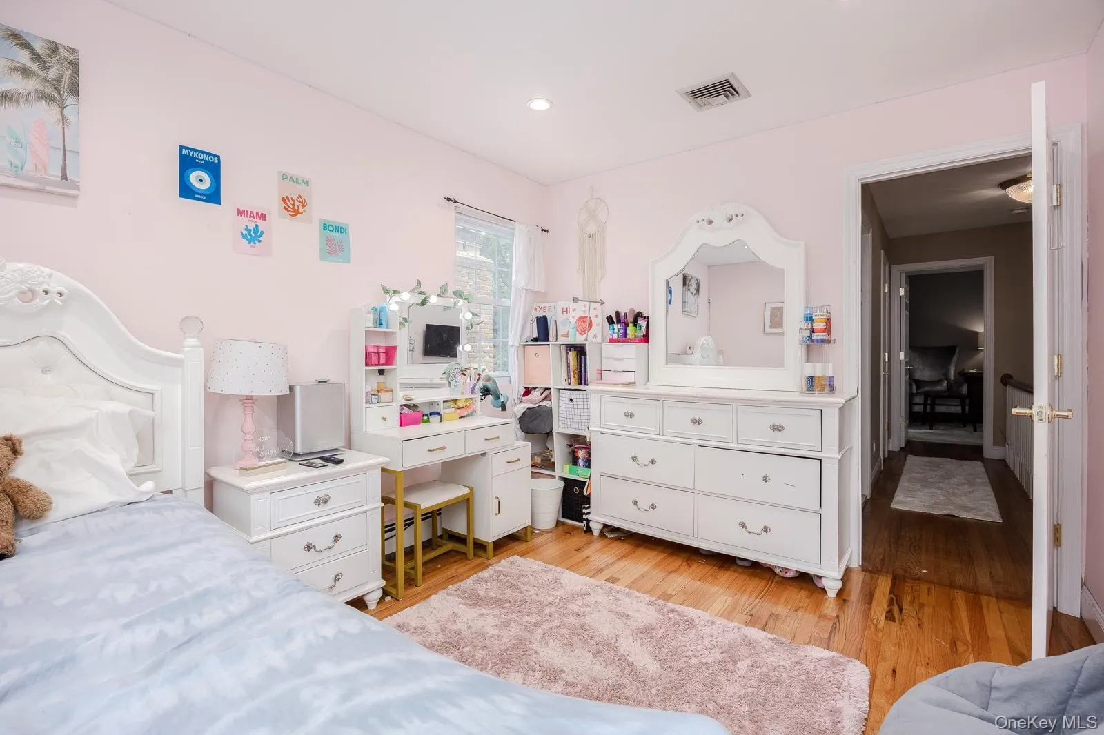 Bedroom 3 recessed ceiling lighting, wood-finish flooring, and a window with natural light Bedroom 3 recessed ceiling lighting, wood-finish flooring, and a window with natural light