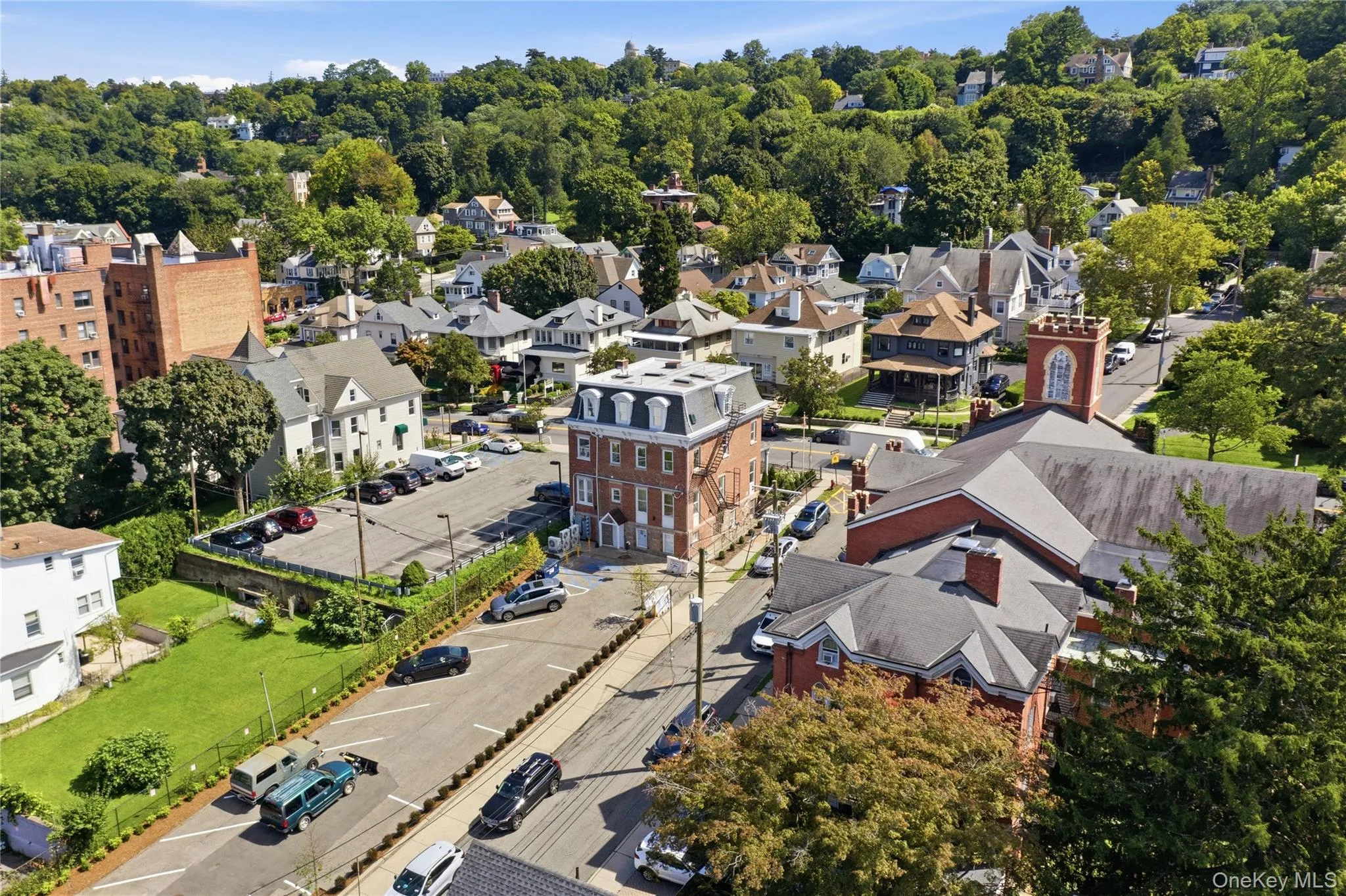 ear View & Convenient ParkingThis rear aerial view showcases the property and its surrounding neighborhood, including the convenient on-site parking area located just behind the residence. The elevated perspective highlights the property’s central Tarrytown setting while demonstrating the added convenience of parking close to the building. ear View & Convenient ParkingThis rear aerial view showcases the property and its surrounding neighborhood, including the convenient on-site parking area located just behind the residence. The elevated perspective highlights the property’s central Tarrytown setting while demonstrating the added convenience of parking close to the building.