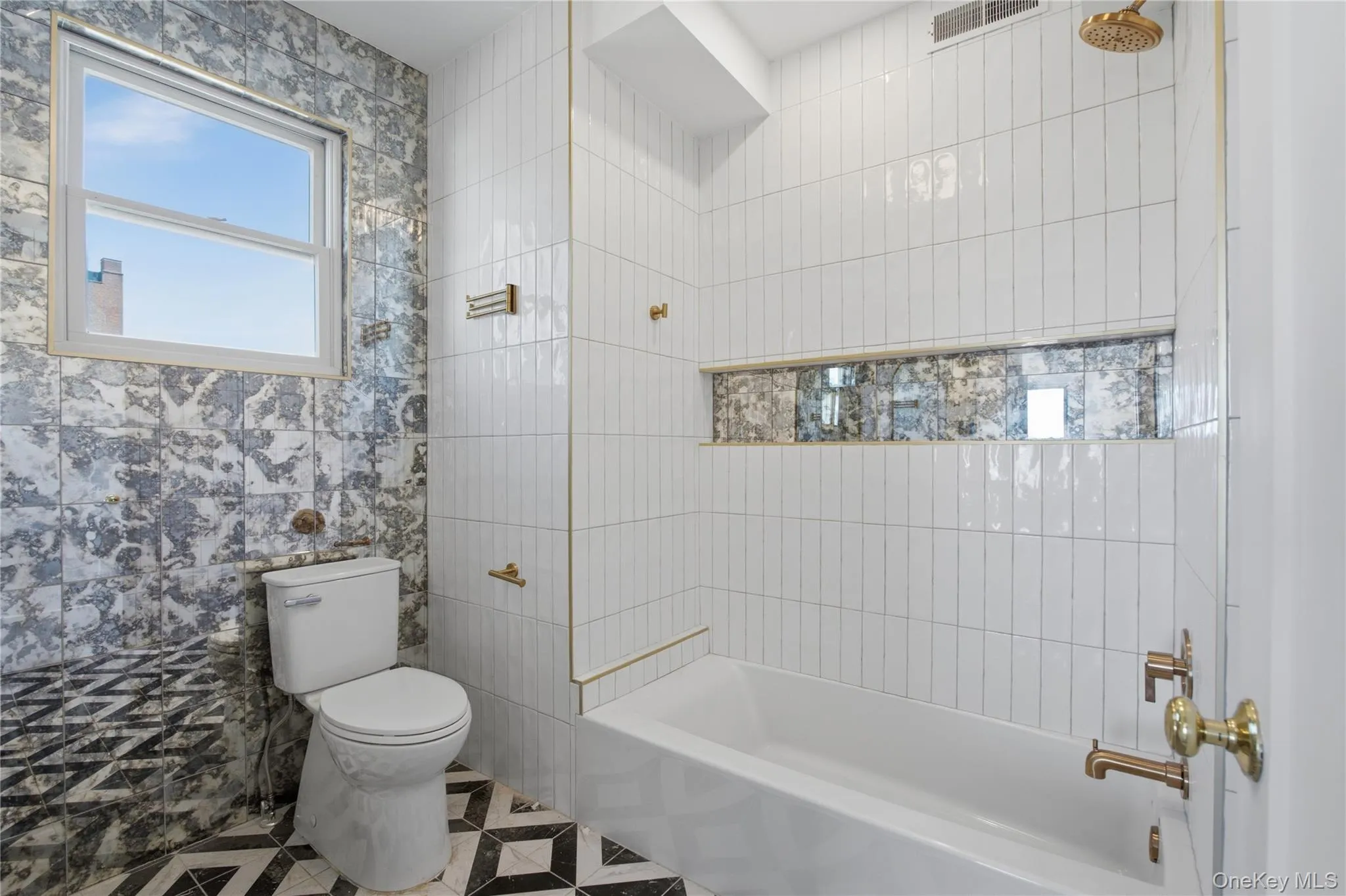 Updated Full BathroomThis bright, beautifully finished full bathroom features a clean contemporary design with stylish tilework and a tub-and-shower combination. A built-in shower niche provides convenient storage, while the window brings in natural light. Fresh, functional, and thoughtfully designed, this bathroom offers comfort and modern appeal for everyday living. Updated Full BathroomThis bright, beautifully finished full bathroom features a clean contemporary design with stylish tilework and a tub-and-shower combination. A built-in shower niche provides convenient storage, while the window brings in natural light. Fresh, functional, and thoughtfully designed, this bathroom offers comfort and modern appeal for everyday living.