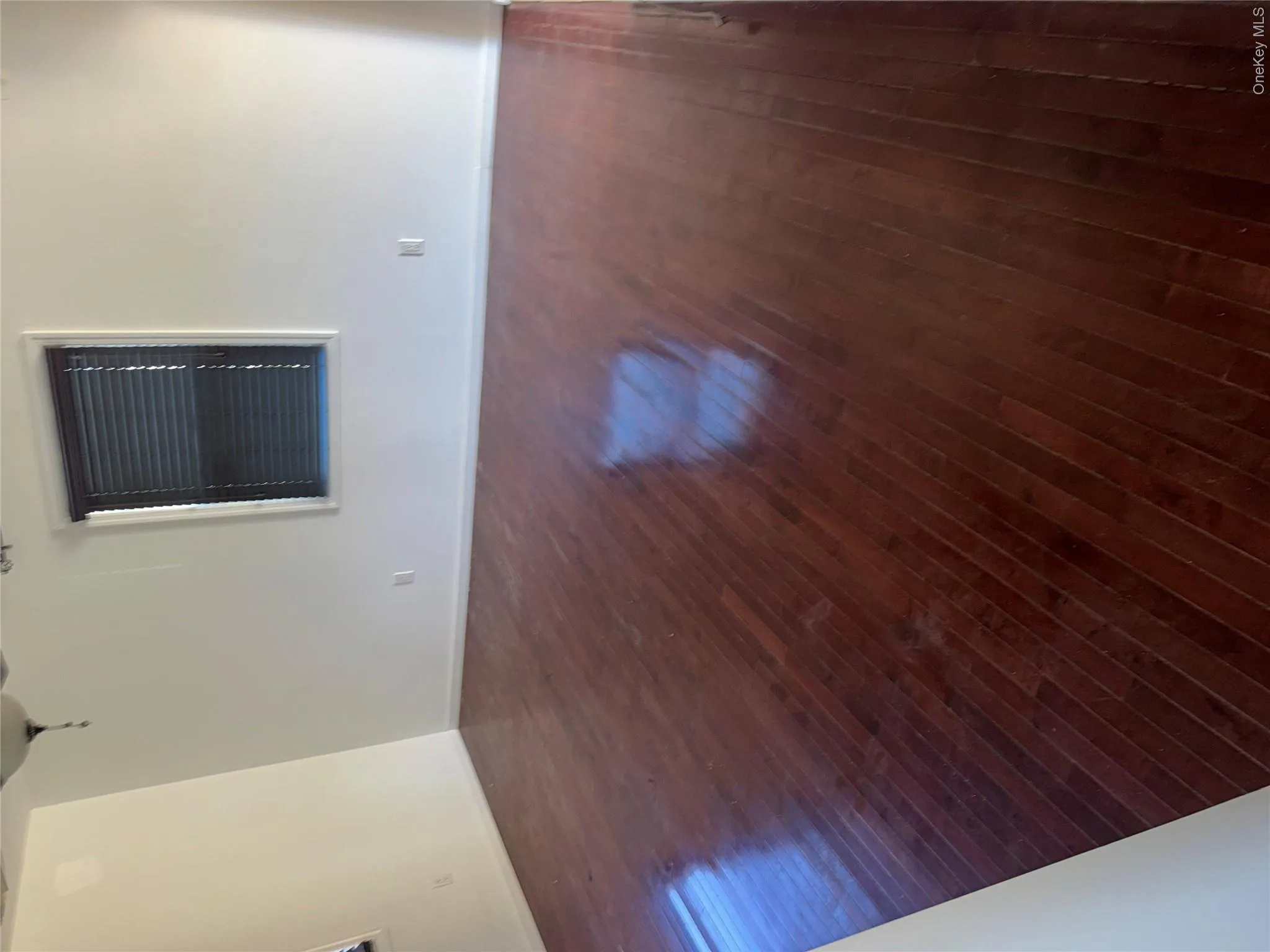 Rich wood-finish flooring complements the neutral wall tones Rich wood-finish flooring complements the neutral wall tones