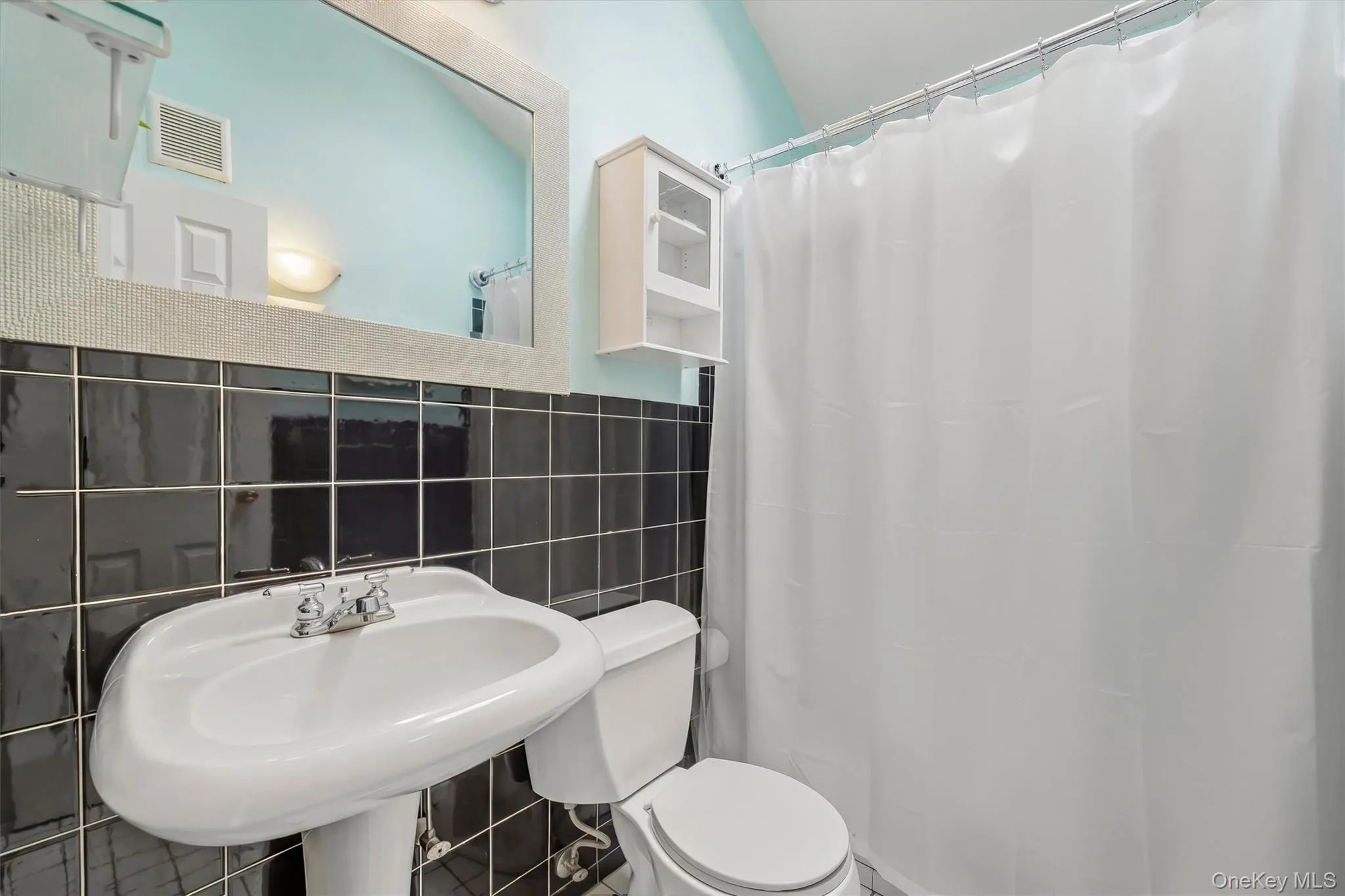 Bathroom near entry and kitchen Bathroom near entry and kitchen