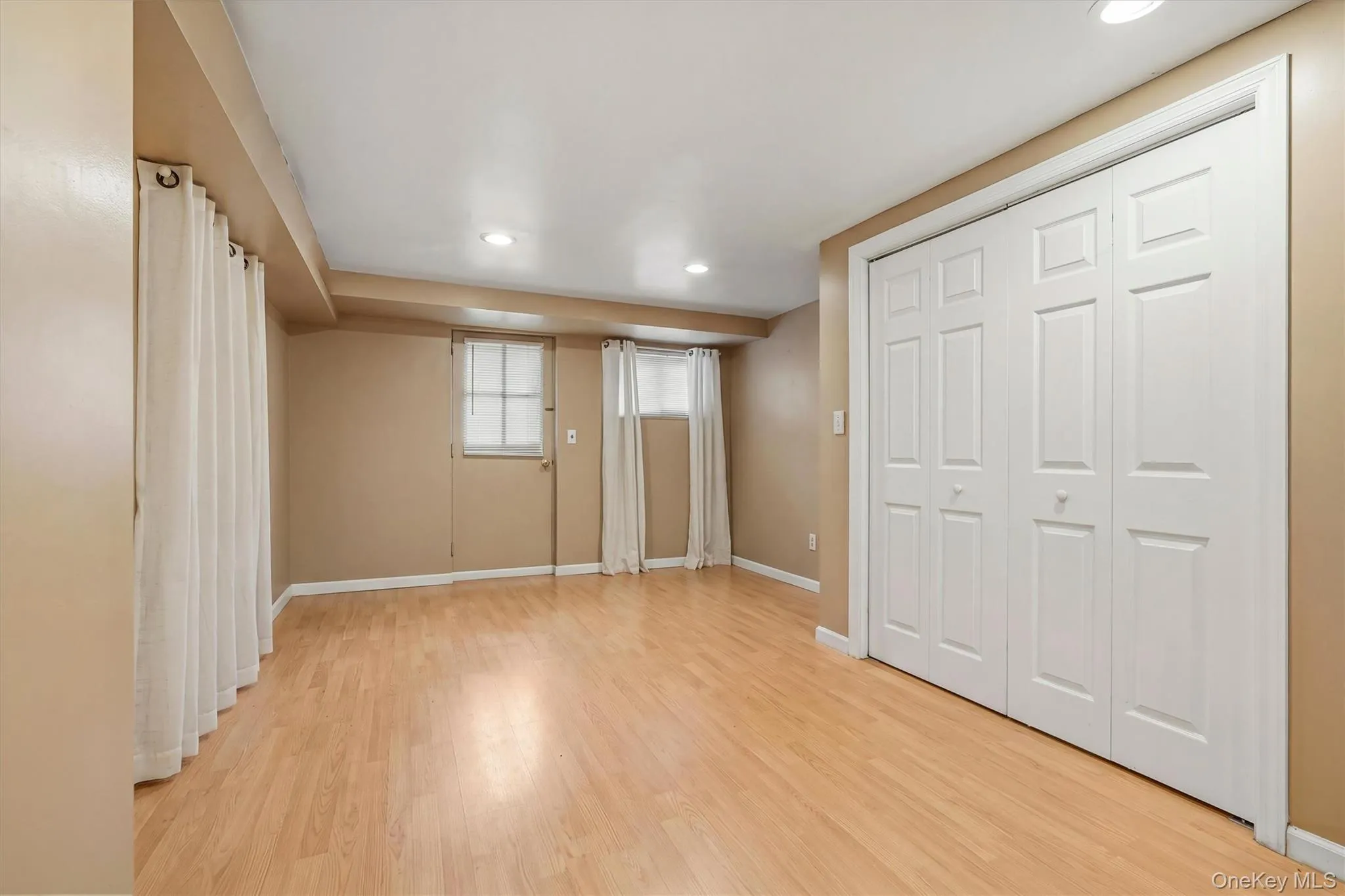3rd Bedroom - Large basement bedroom showing walk-out to back yard 3rd Bedroom - Large basement bedroom showing walk-out to back yard