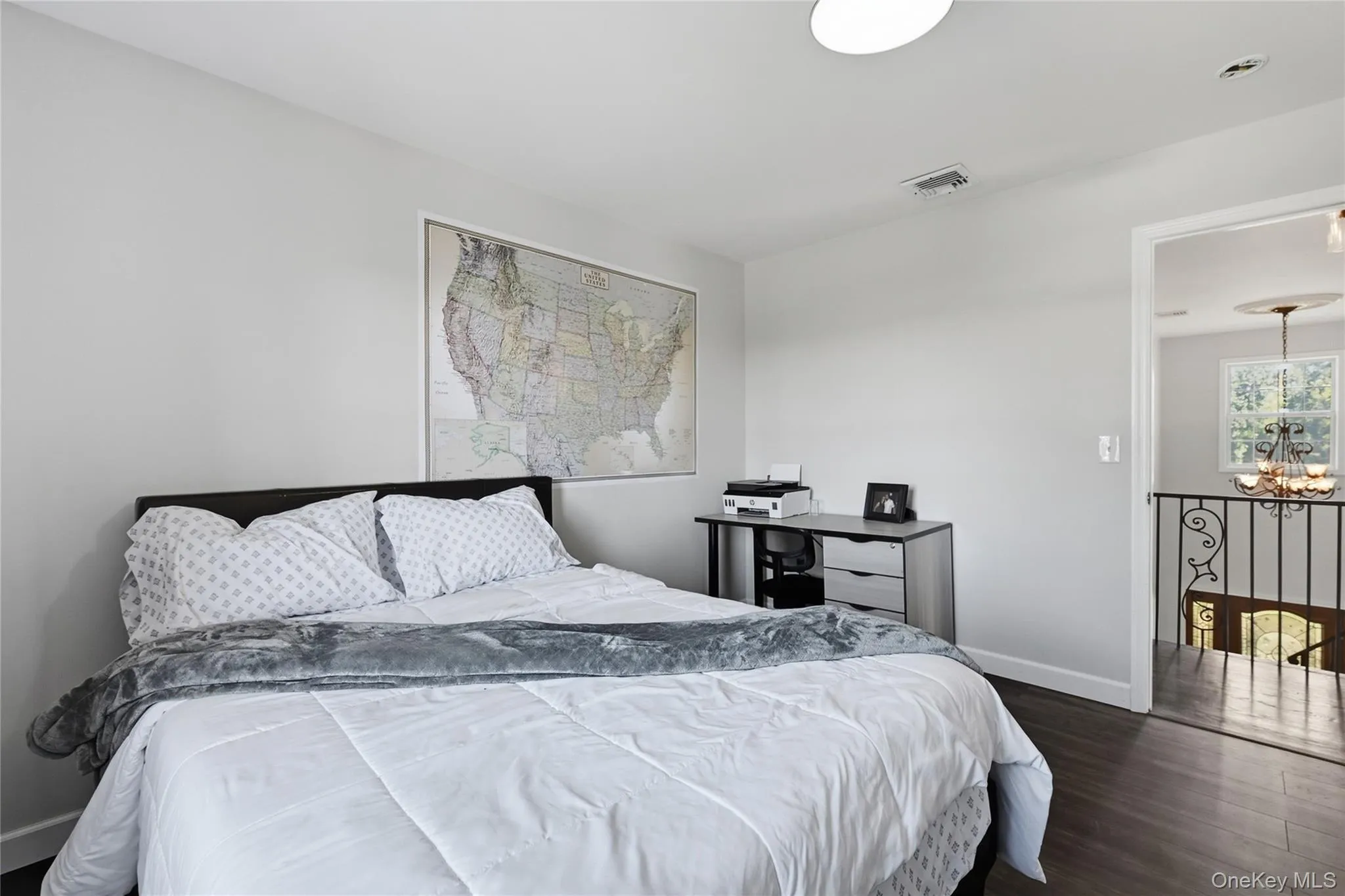 Wood-finish flooring with white walls and trim Wood-finish flooring with white walls and trim