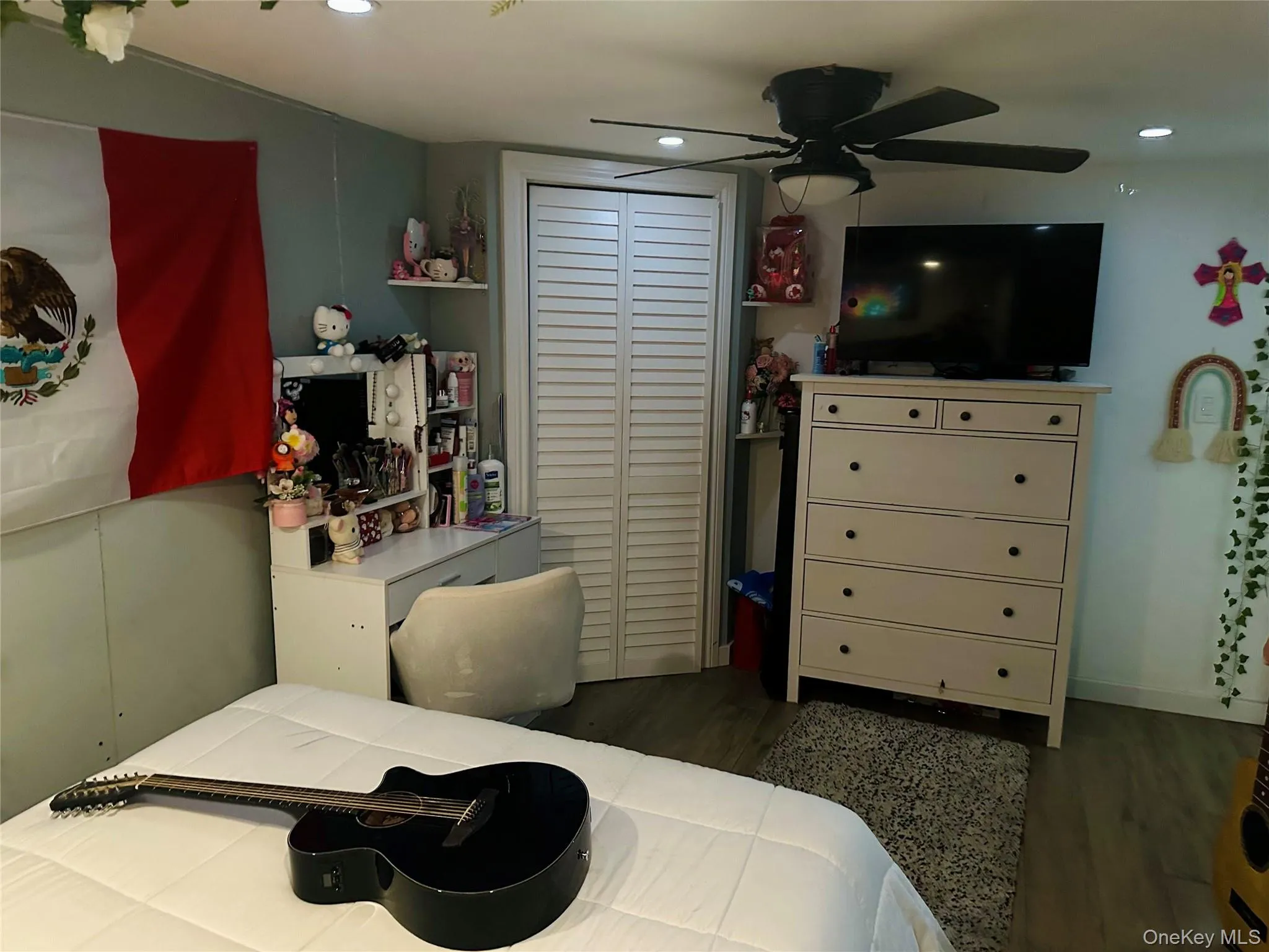 Bedroom featuring recessed lighting, a closet, a ceiling fan, and wood finished floors Bedroom featuring recessed lighting, a closet, a ceiling fan, and wood finished floors
