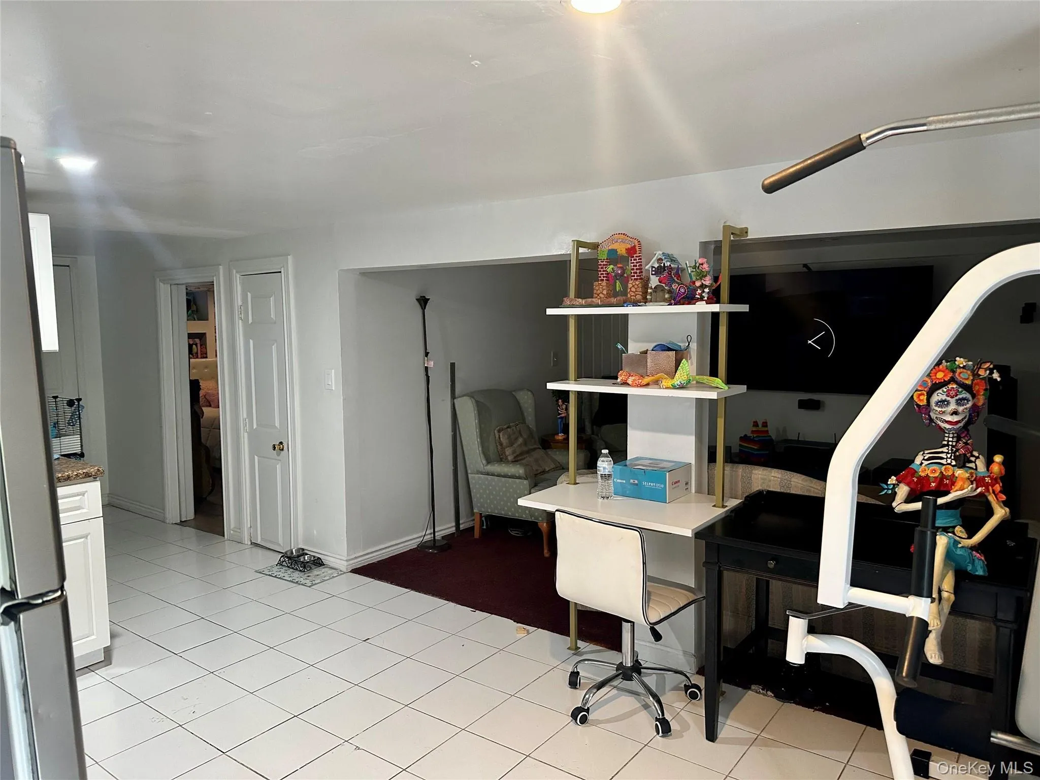 Home office featuring light tile patterned floors Home office featuring light tile patterned floors