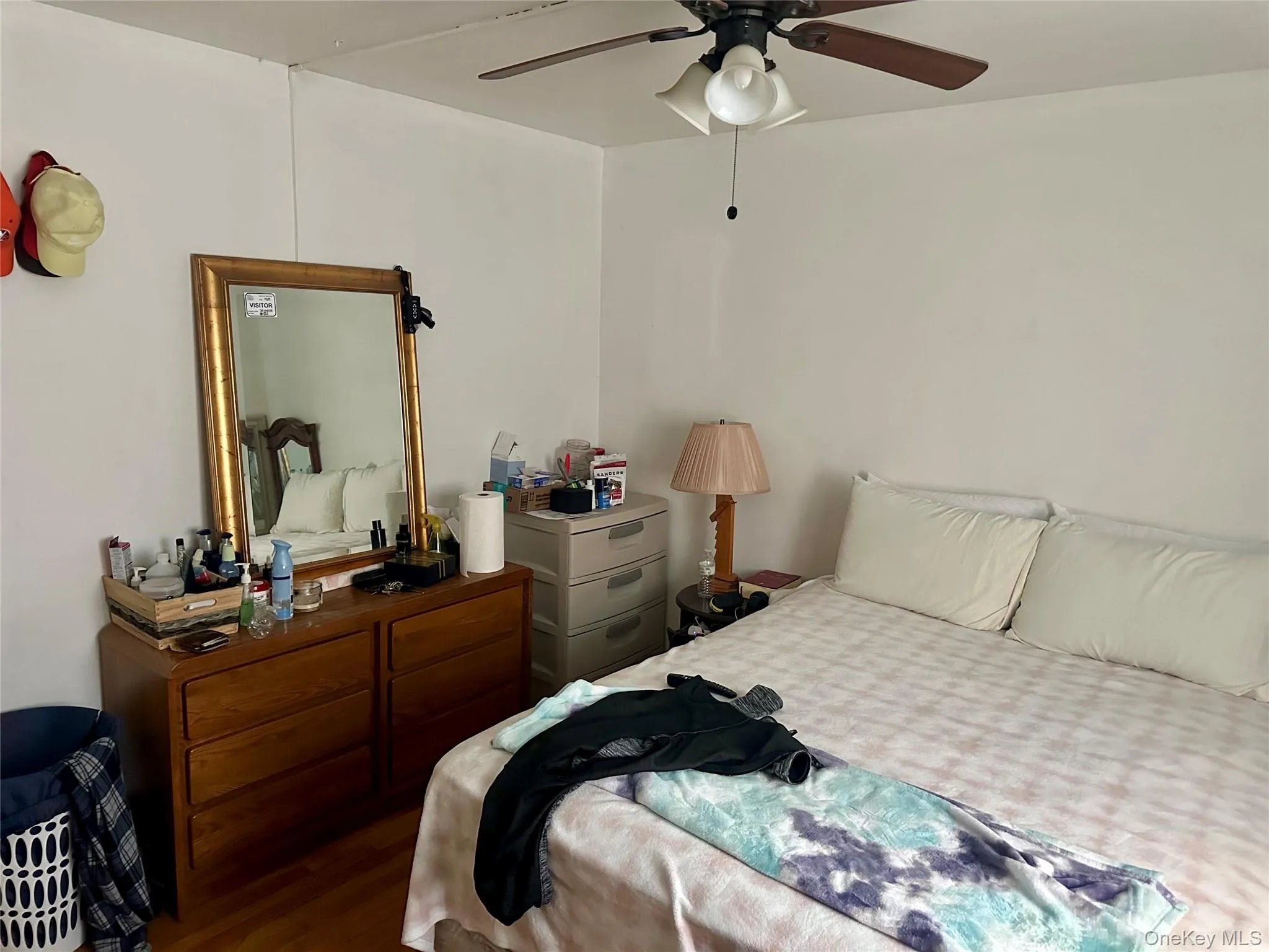 Bedroom with ceiling fan and wood finished floors Bedroom with ceiling fan and wood finished floors