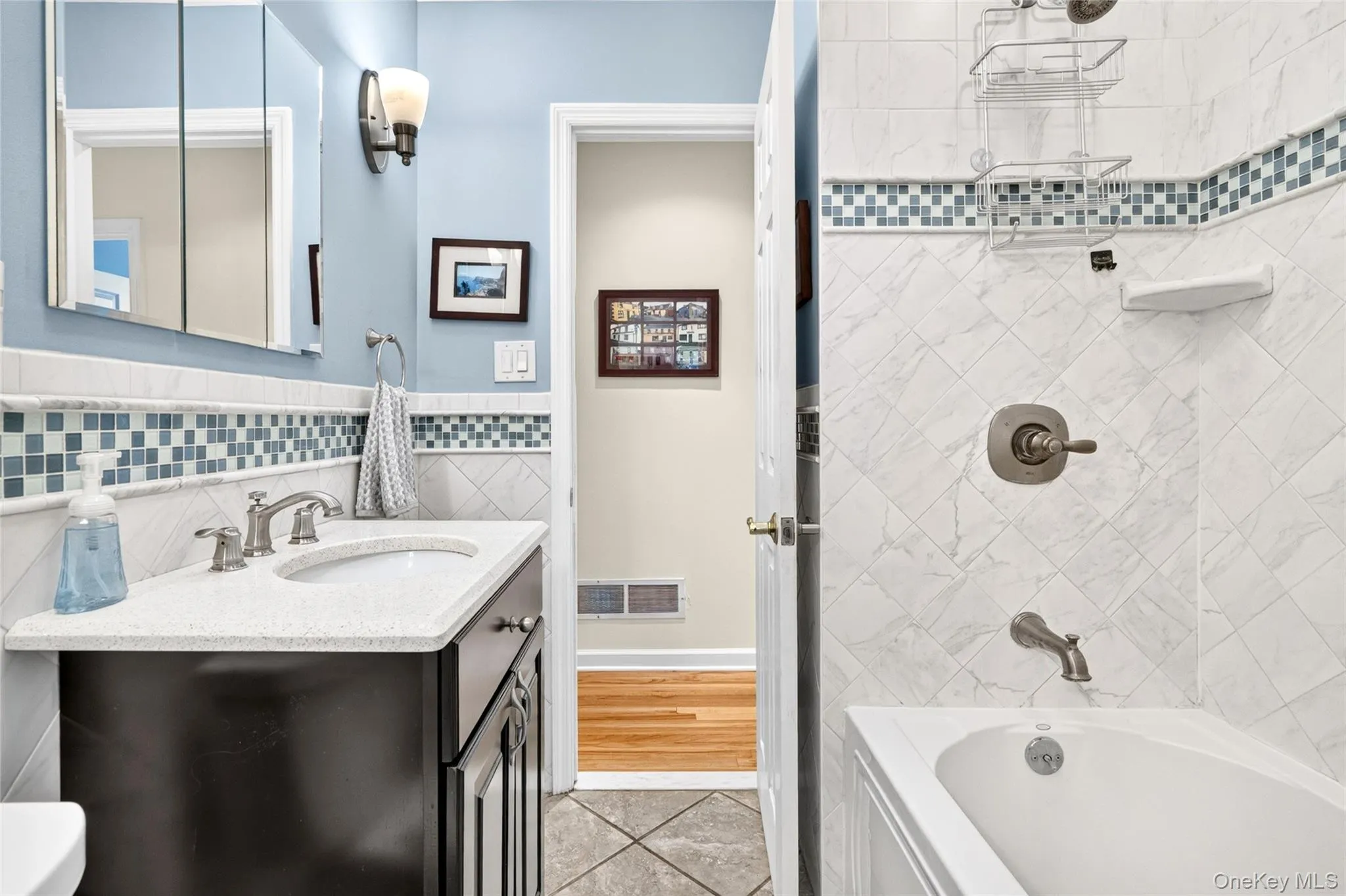 Updated Hallway bathroom with shared access from Primary bedroom Updated Hallway bathroom with shared access from Primary bedroom