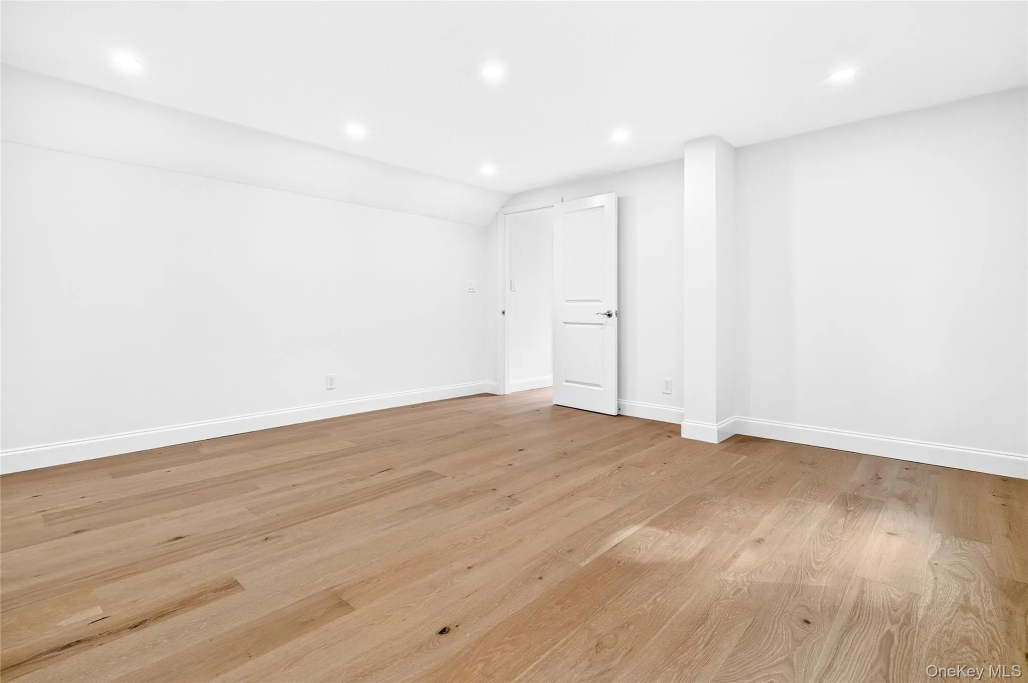 Recessed lighting illuminates wood-finish flooring Recessed lighting illuminates wood-finish flooring