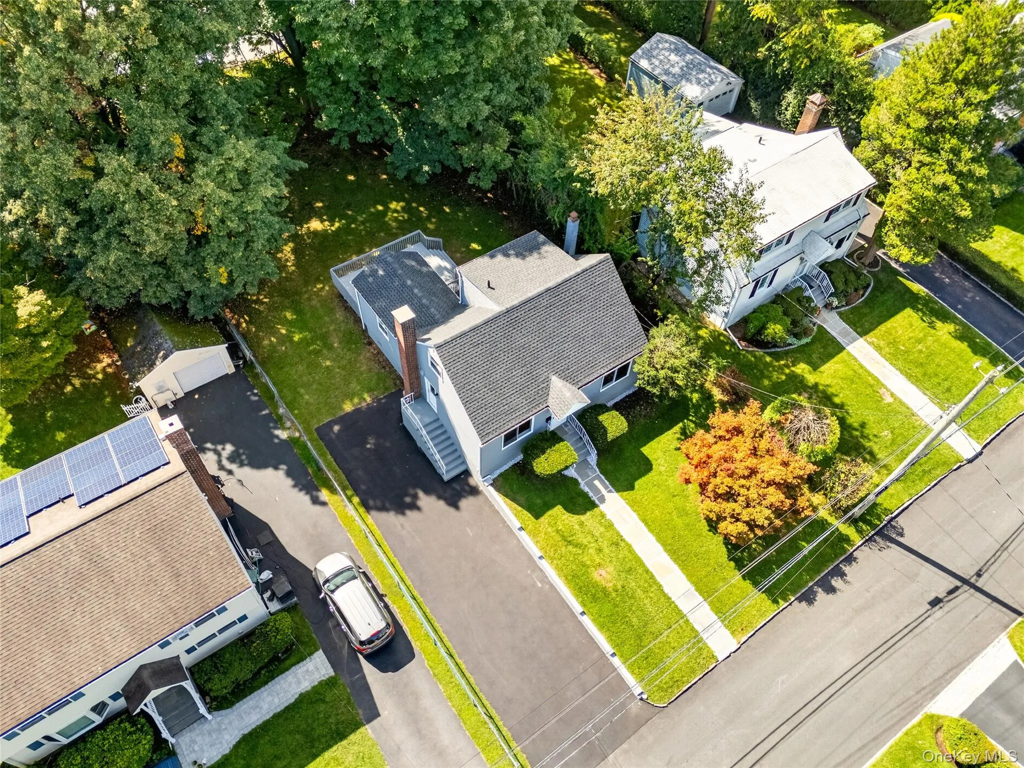 Gray siding exterior with dark gray shingle roofing Gray siding exterior with dark gray shingle roofing