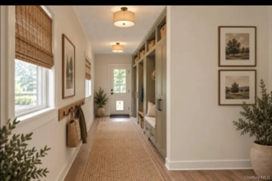 Virtually staged entryway from the side entrance. Virtually staged entryway from the side entrance.