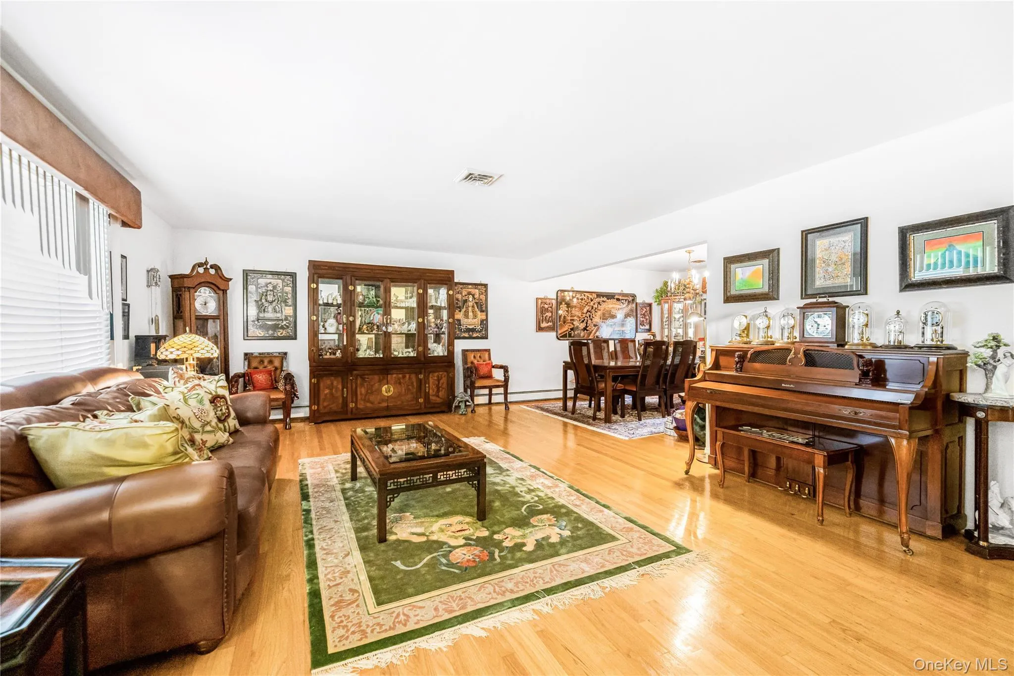 Light wood-finish flooring, white walls, and a multi-level floor plan with visible stairs Light wood-finish flooring, white walls, and a multi-level floor plan with visible stairs