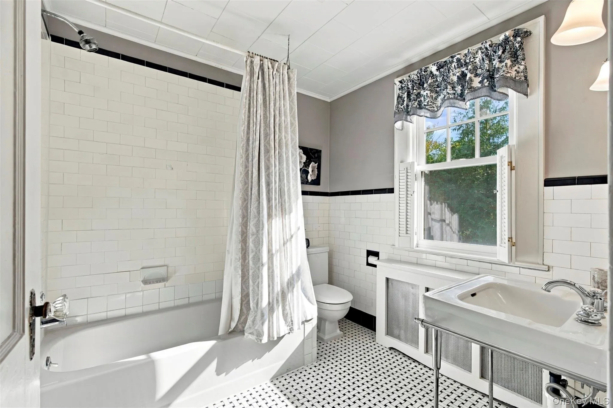 Classic black & white tiling and pedestal sink. Classic black & white tiling and pedestal sink.