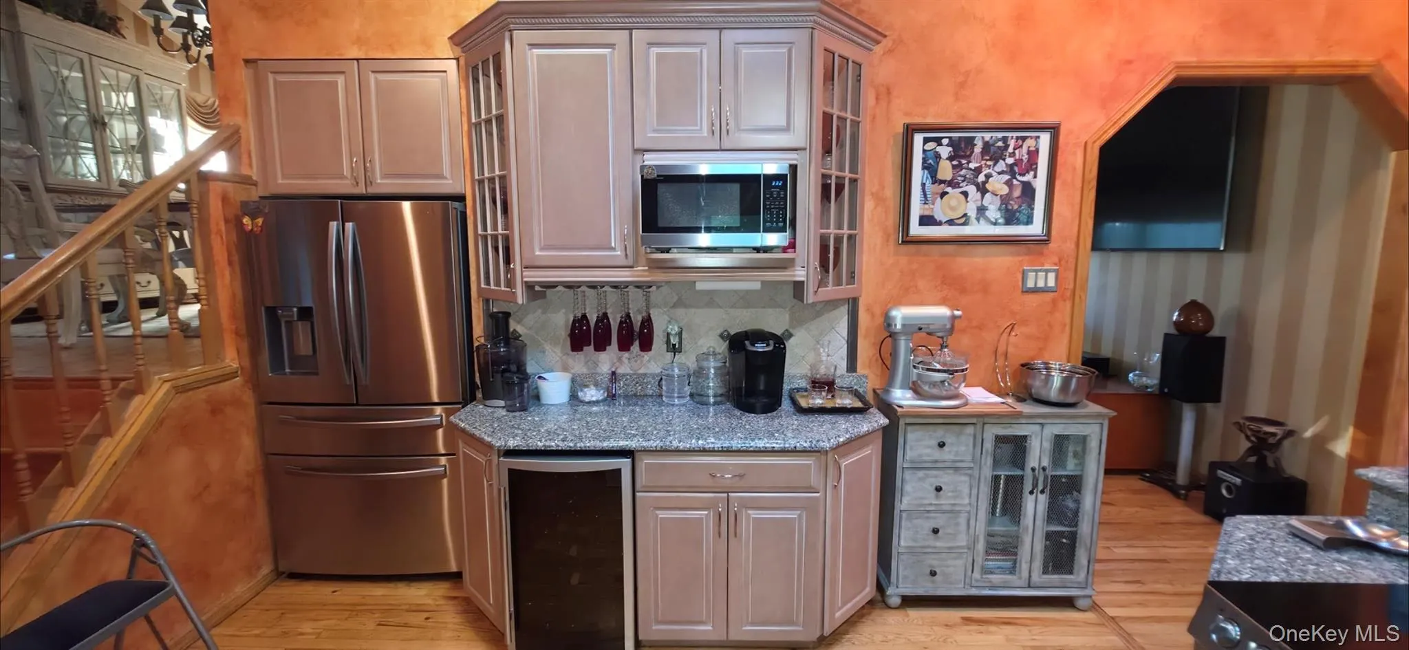 Stainless steel appliances, built-in microwave, granite countertops, and light wood-finish cabinetry Stainless steel appliances, built-in microwave, granite countertops, and light wood-finish cabinetry