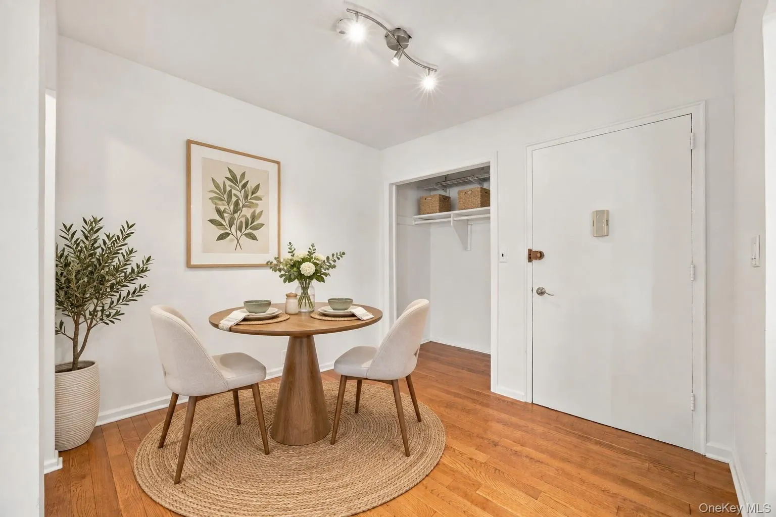 Entry foyer, virtually staged as a breakfast nook. Entry foyer, virtually staged as a breakfast nook.