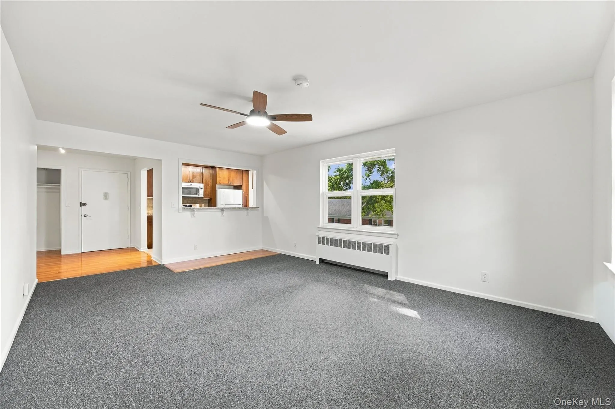 Living/dining room with breakfast bar. Living/dining room with breakfast bar.