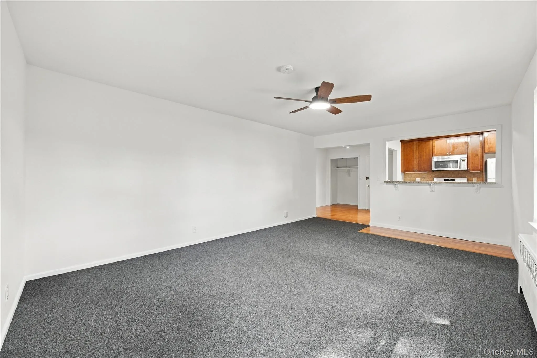 Living/dining room with breakfast bar. Living/dining room with breakfast bar.
