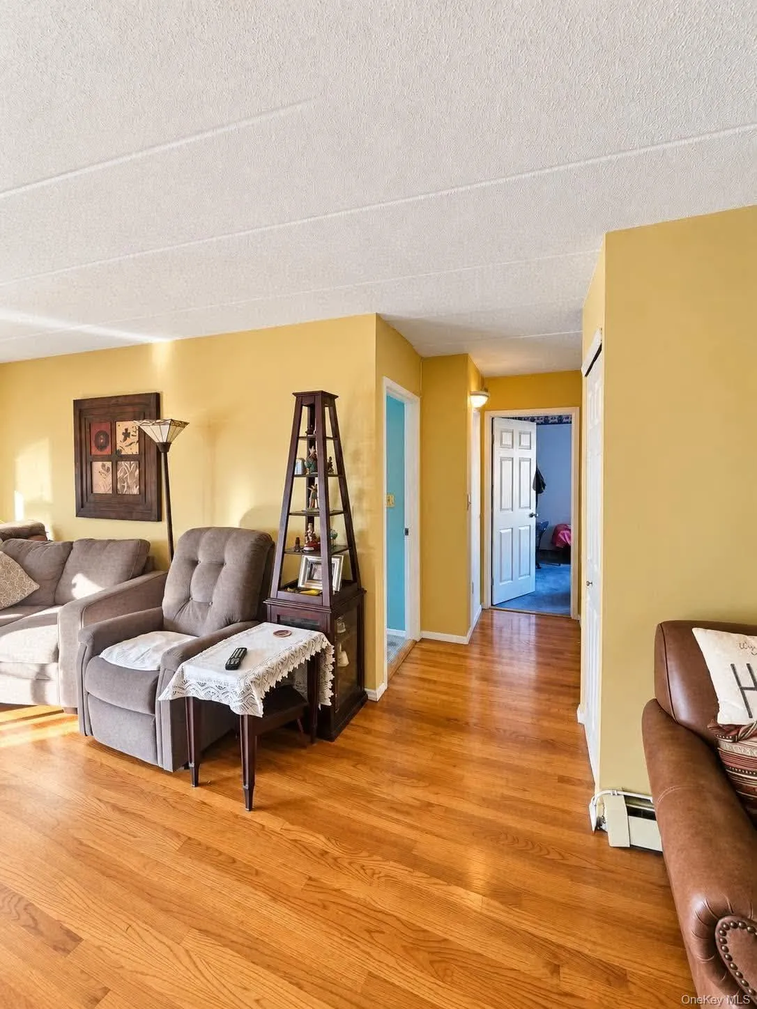 Hardwood flooring, painted walls, and white trim Hardwood flooring, painted walls, and white trim