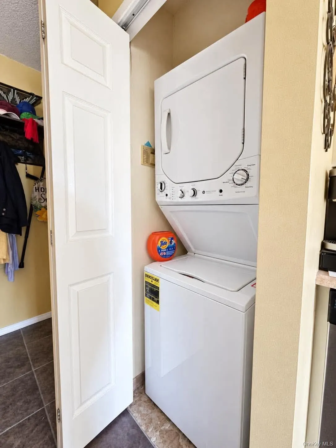 Stackable laundry appliances within a dedicated closet Stackable laundry appliances within a dedicated closet