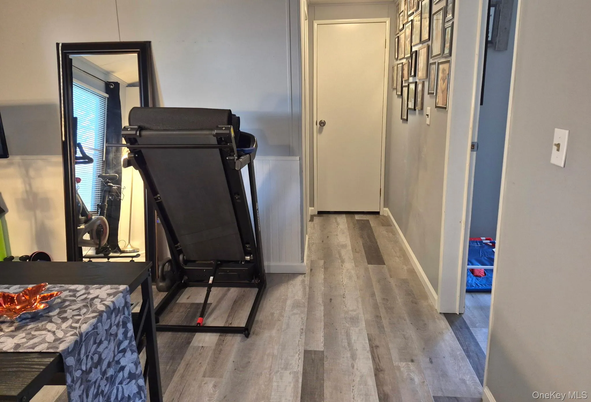 Wood-finish flooring throughout, complemented by a chair rail accent Wood-finish flooring throughout, complemented by a chair rail accent