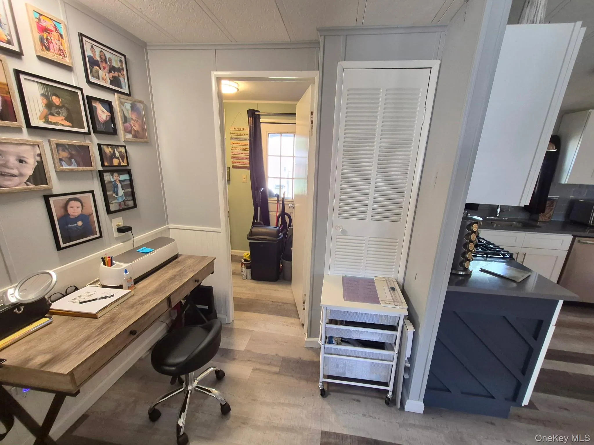 Wood-finish flooring throughout, with wainscoting and paneled walls Wood-finish flooring throughout, with wainscoting and paneled walls