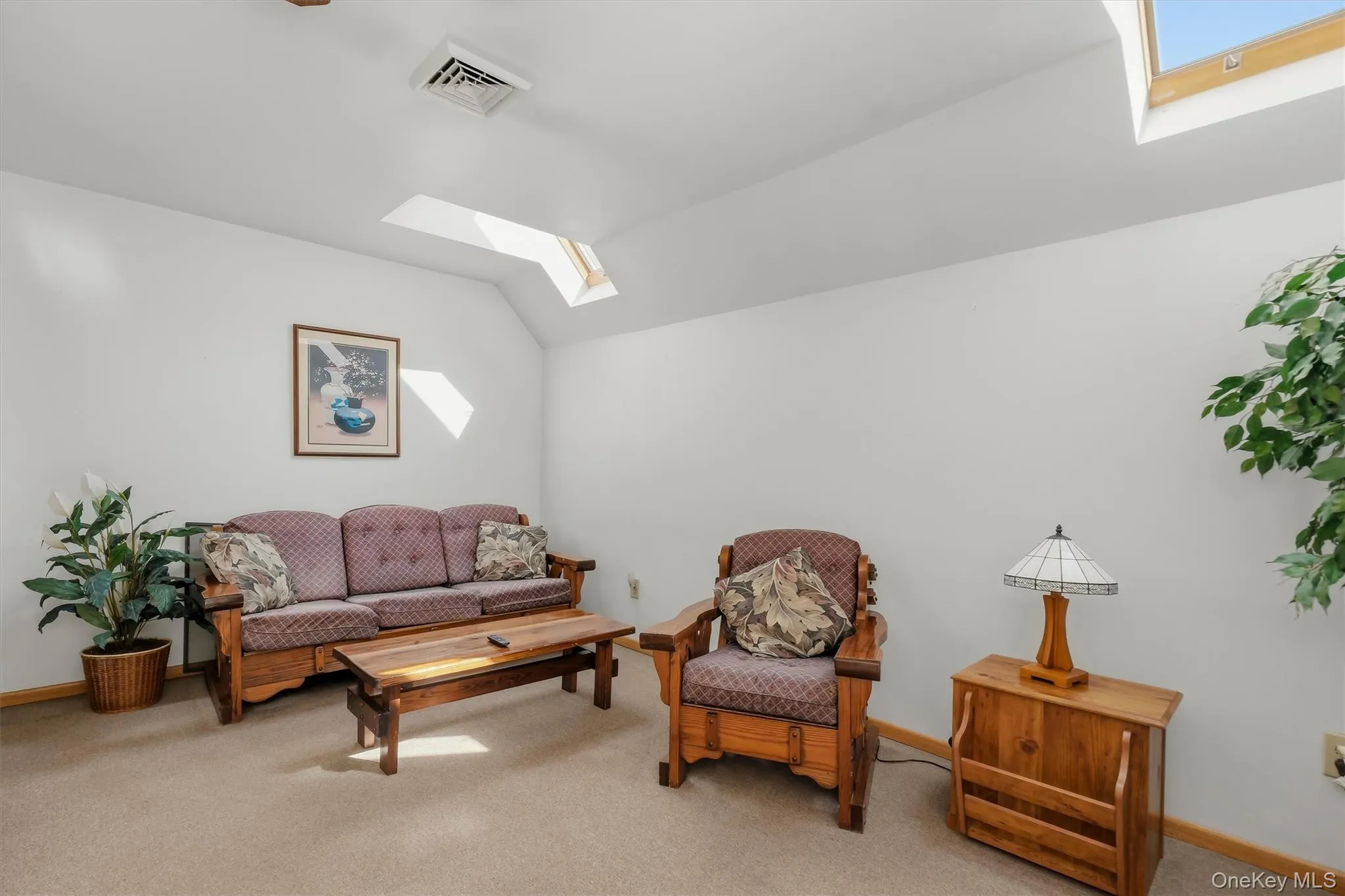 The finished space over the garage is quite comfortable with a tray ceiling, skylights and a full bathroom. It would be great for an office, teen space or studio! The finished space over the garage is quite comfortable with a tray ceiling, skylights and a full bathroom. It would be great for an office, teen space or studio!