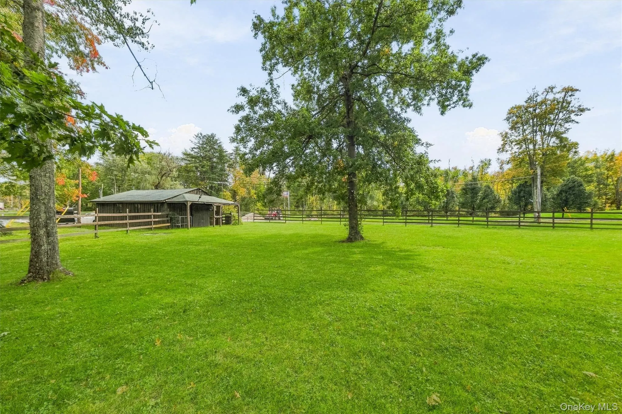 The barn has a large attached paddock with shelter, board fencing, shade trees and multiple gates. Perfect for retirees or a herd of minis! The barn could also lend itself to many other uses such as a studio, storage or workshop. The barn has a large attached paddock with shelter, board fencing, shade trees and multiple gates. Perfect for retirees or a herd of minis! The barn could also lend itself to many other uses such as a studio, storage or workshop.